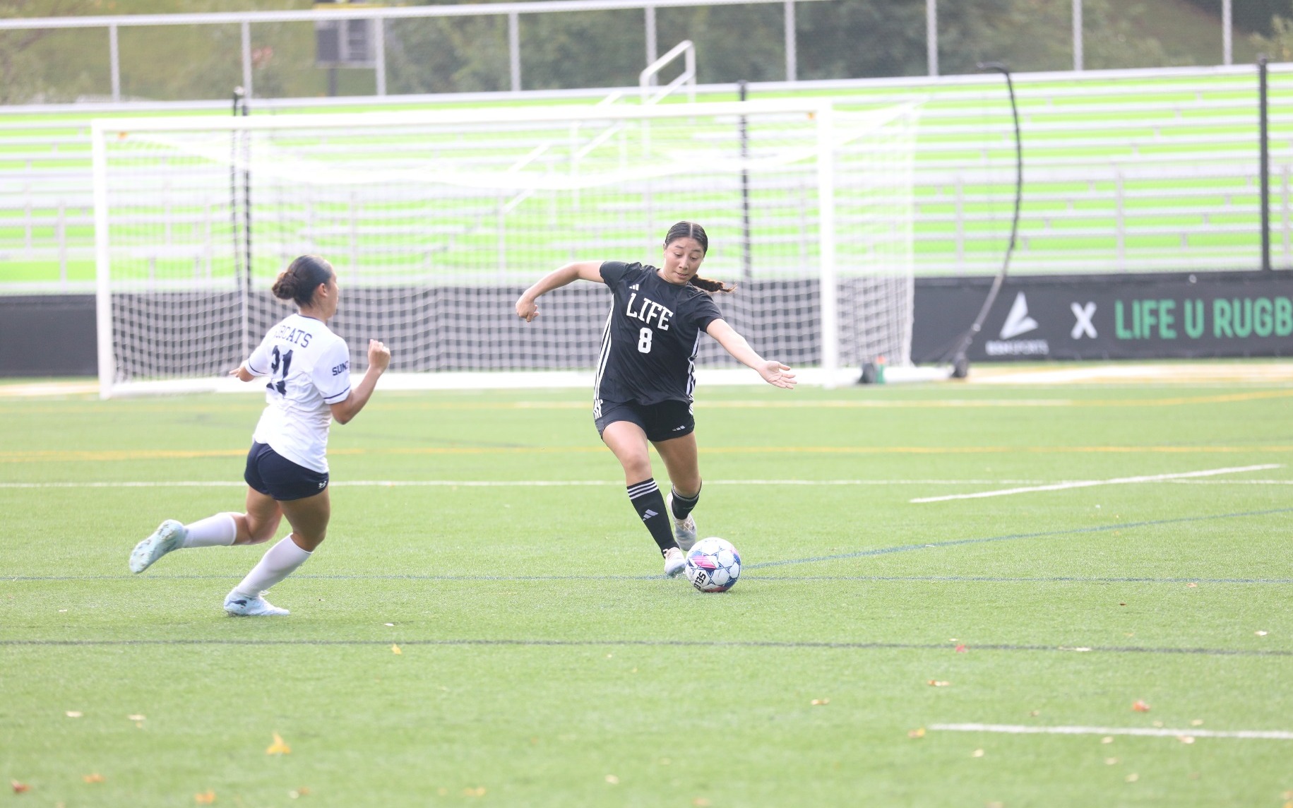 Naomi Calvillo Passes Ball from Backline