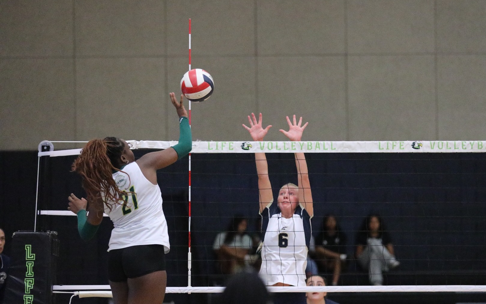 Medney Garraux Hits Ball above the Net 