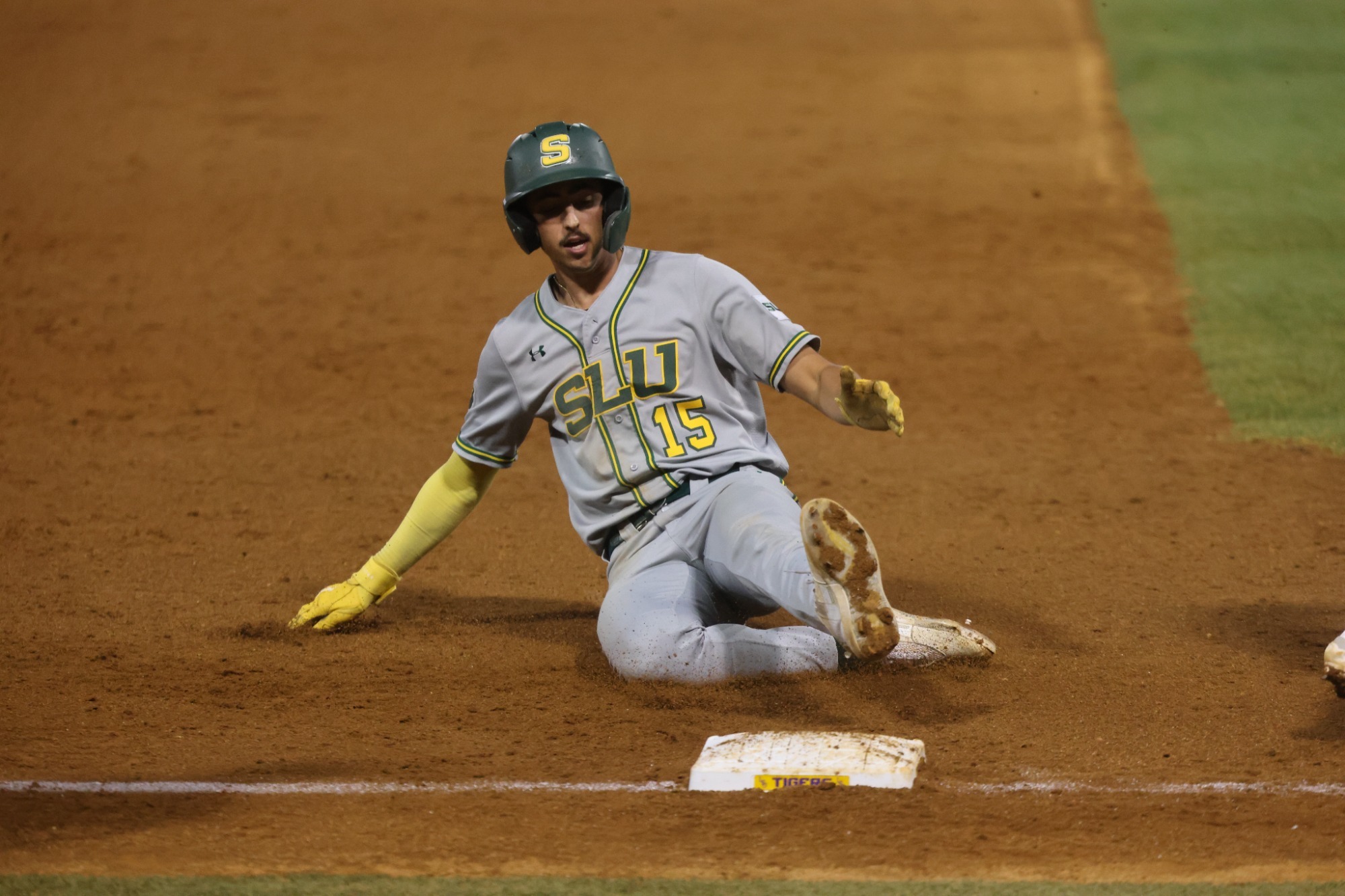 TJ Salvaggio slides into third base.