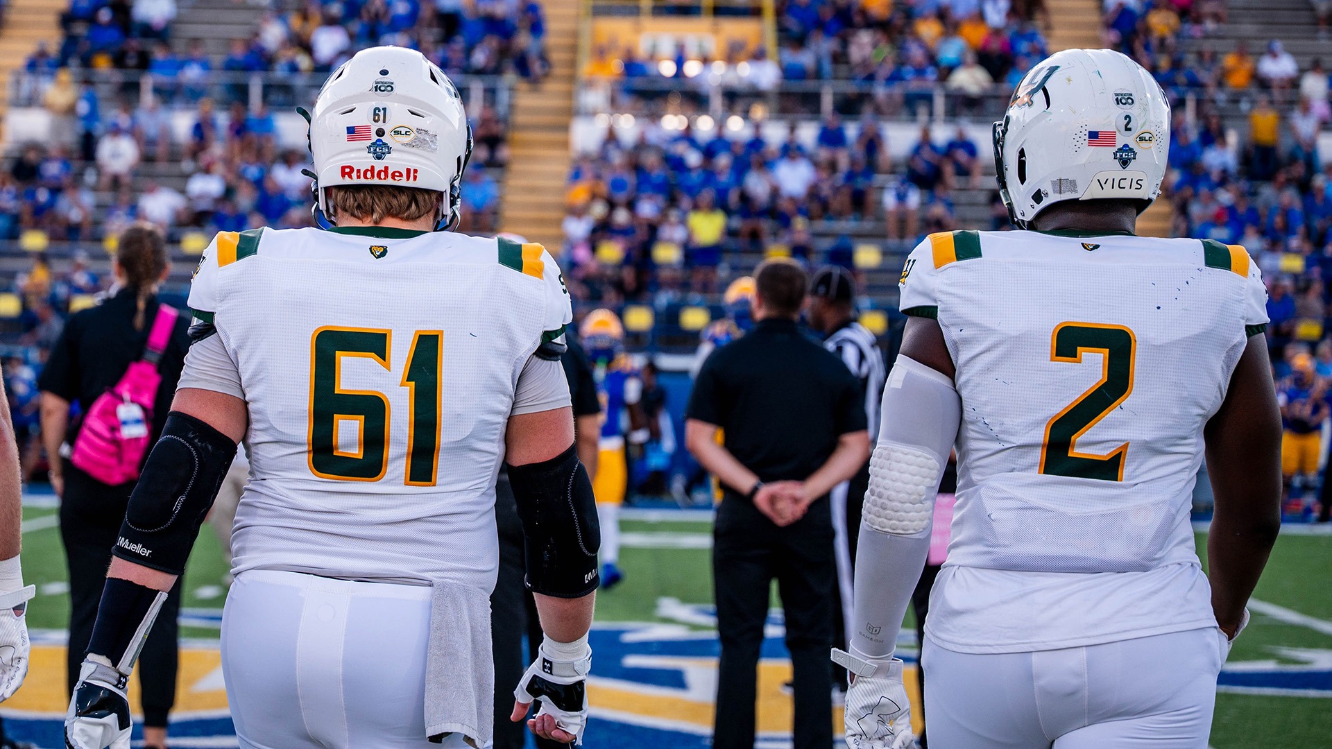 Holden Kareokowsky (61) and Kaleb Proctor (2) serve as team captains at McNeese on Oct. 4, 2025