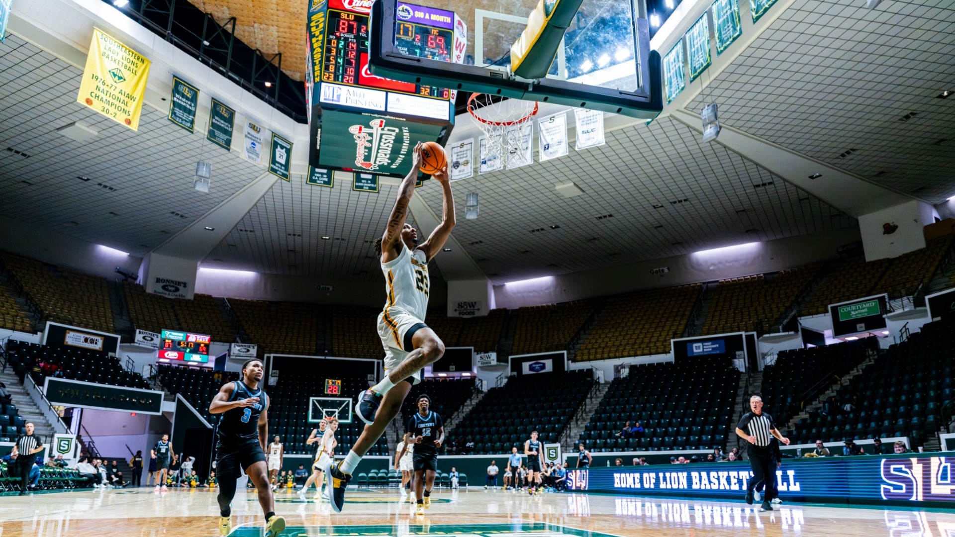 Isaiah Gaines dunks in transition vs William Carey at home