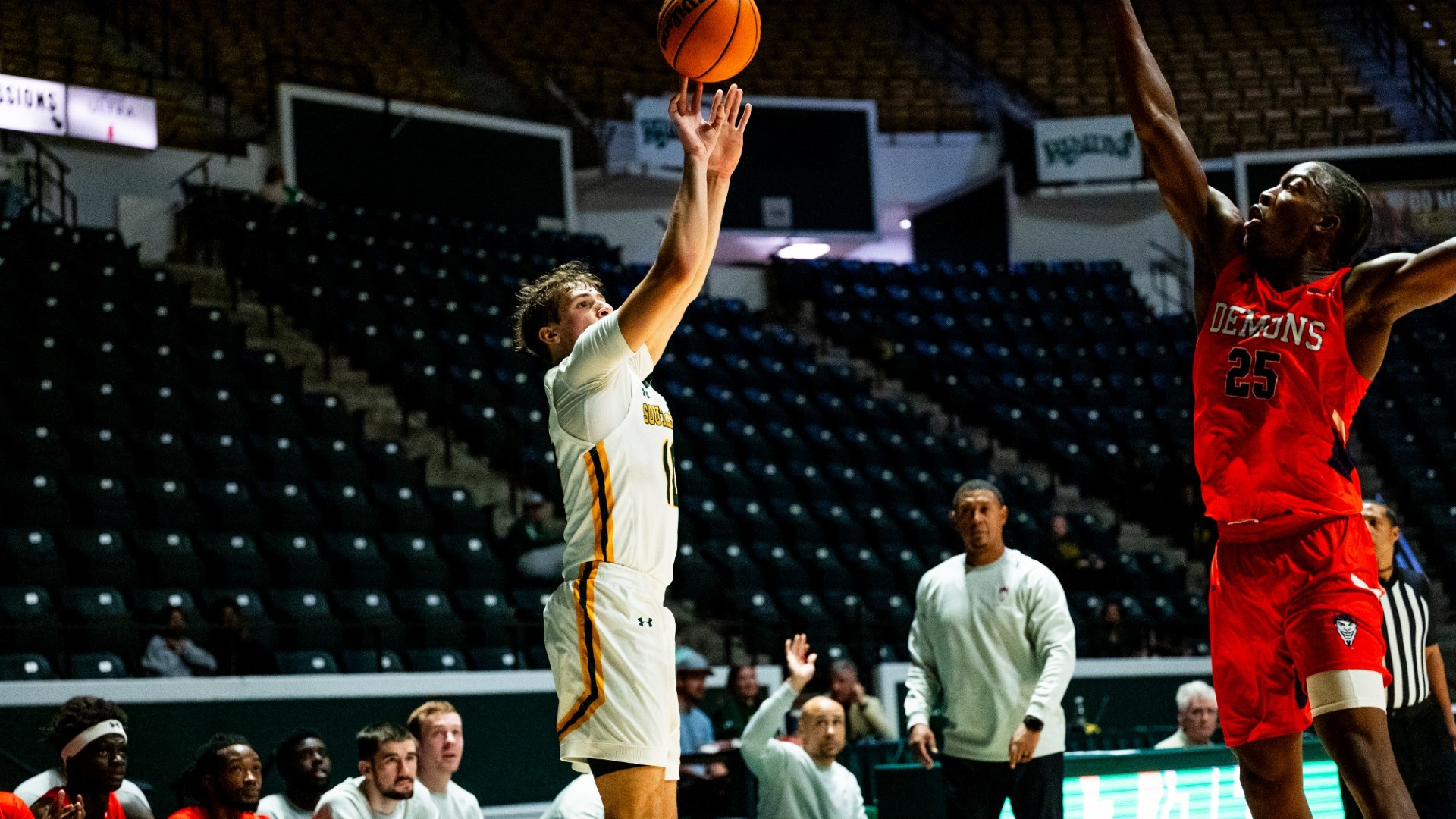 Jaiden Lawrence shooting a corner three-pointer vs Northwestern State defender in the University Center