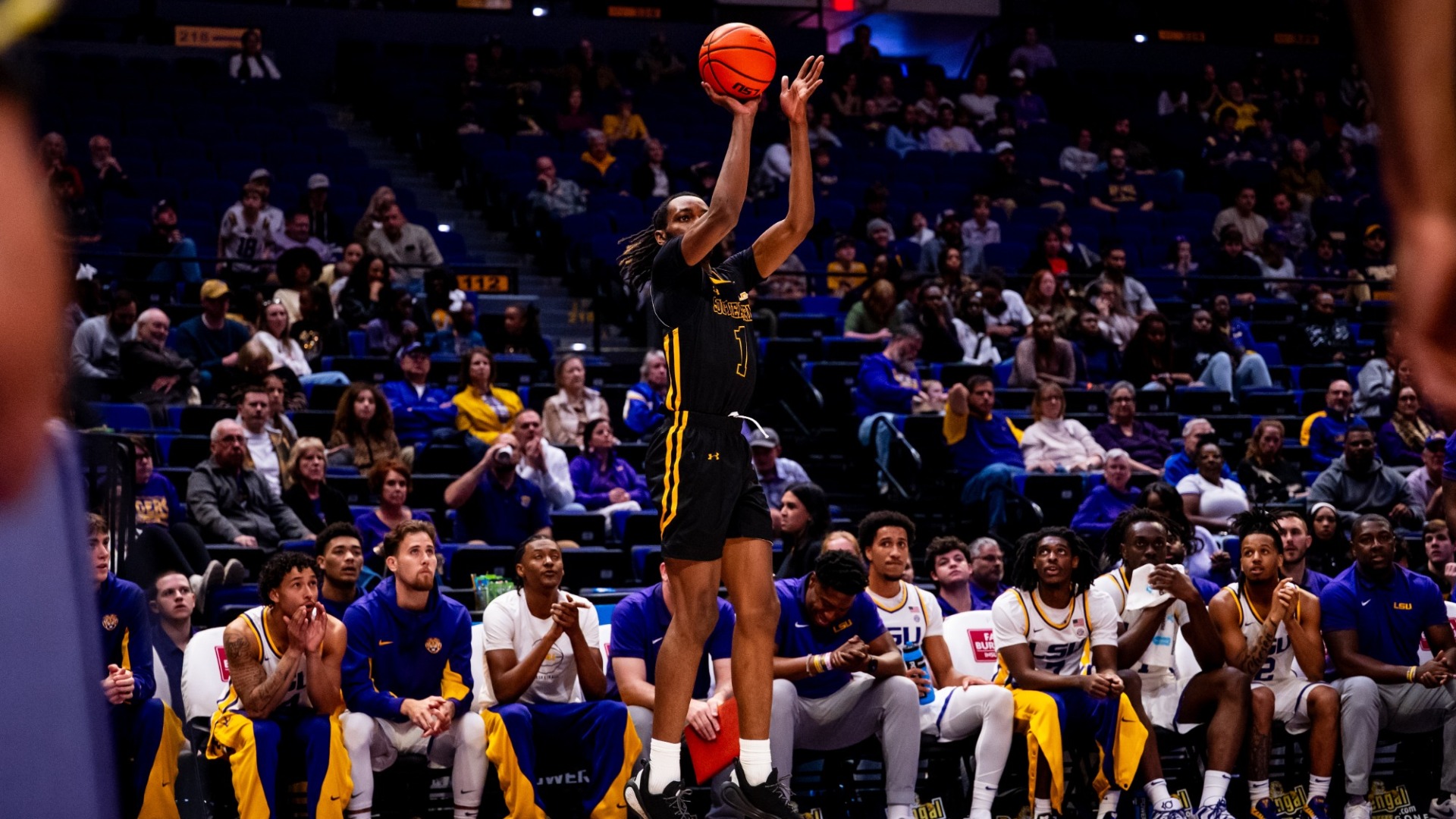 Makhi Myles shooting a three-pointer vs LSU in the Pete Maravich Assembly Center
