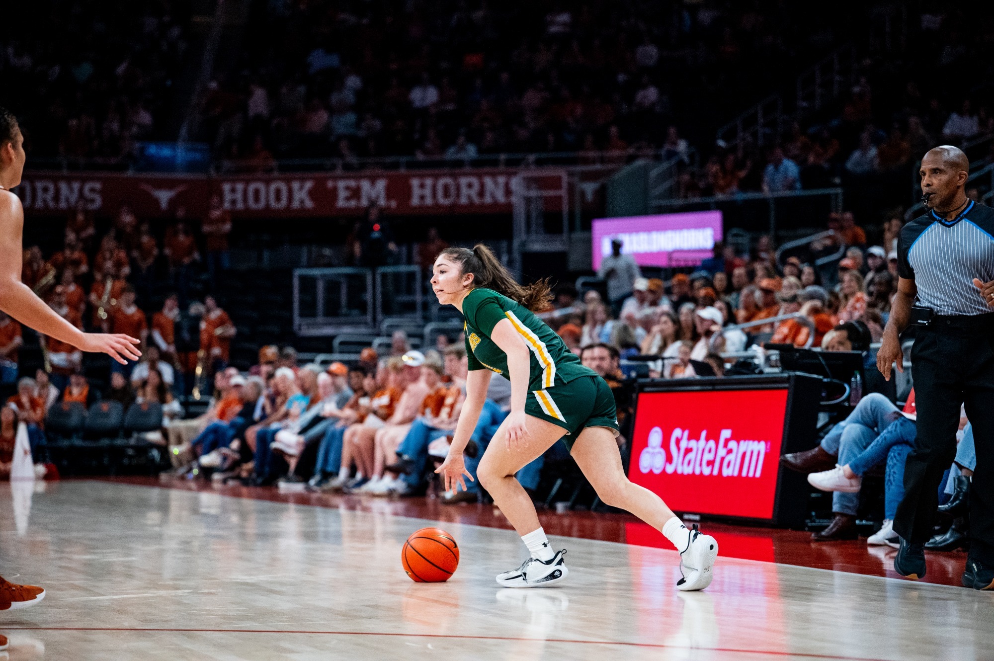 Mia Ramos looks to pass vs. Texas in the Moody Center