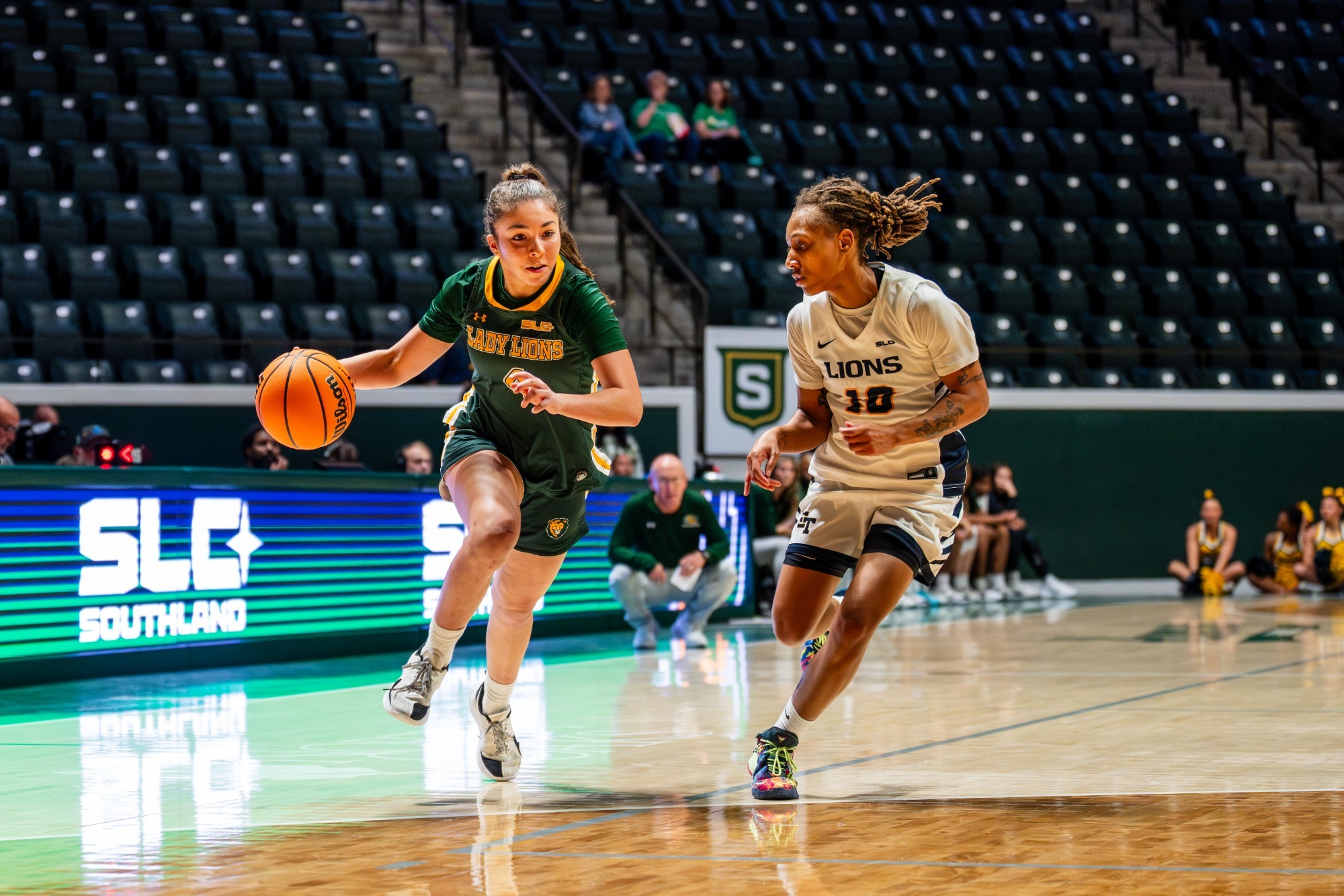 Mia Ramos dribbles past East Texas A&M