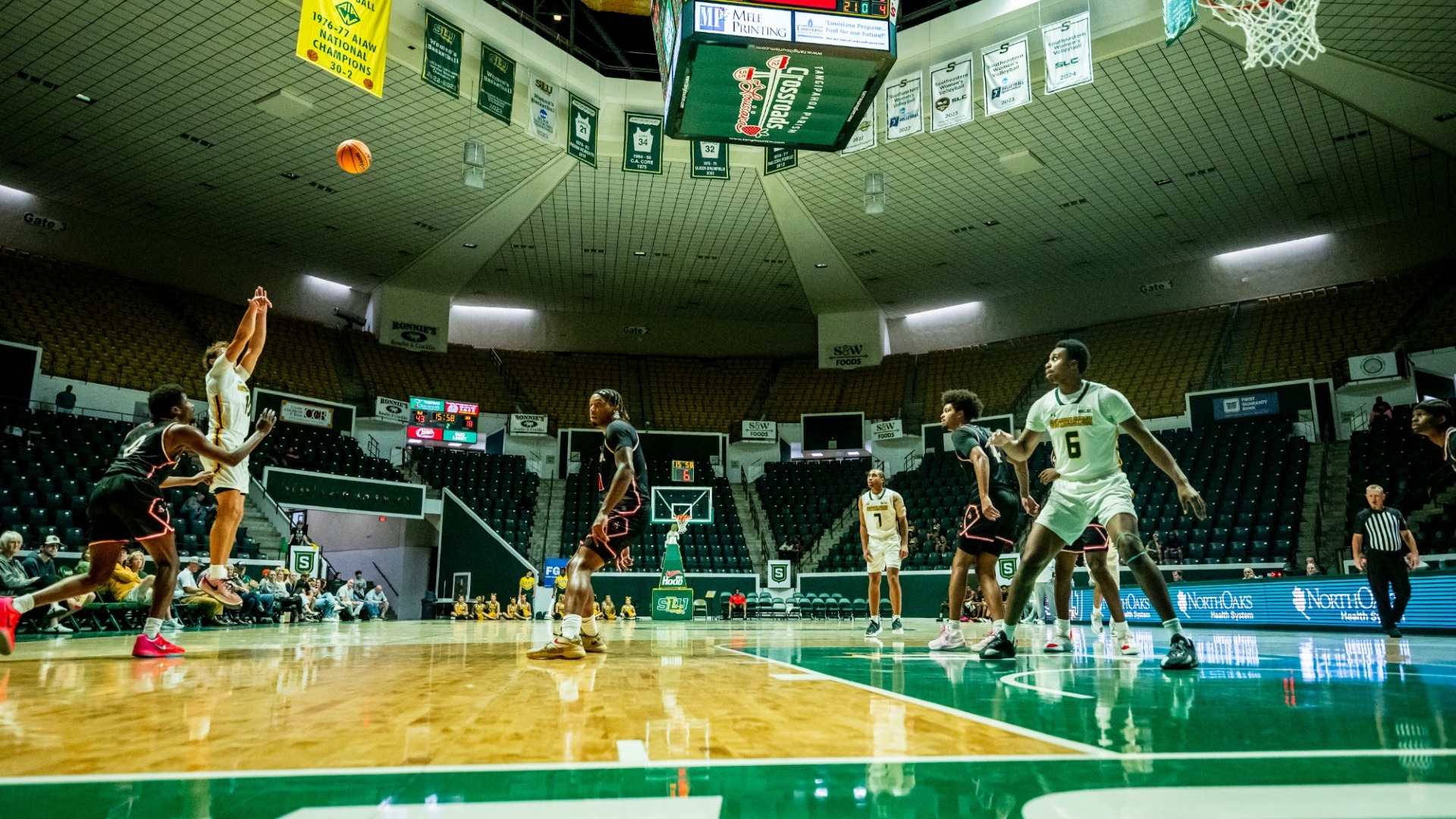 Jaiden Lawrence shooting from the three-point line vs William Carey at home