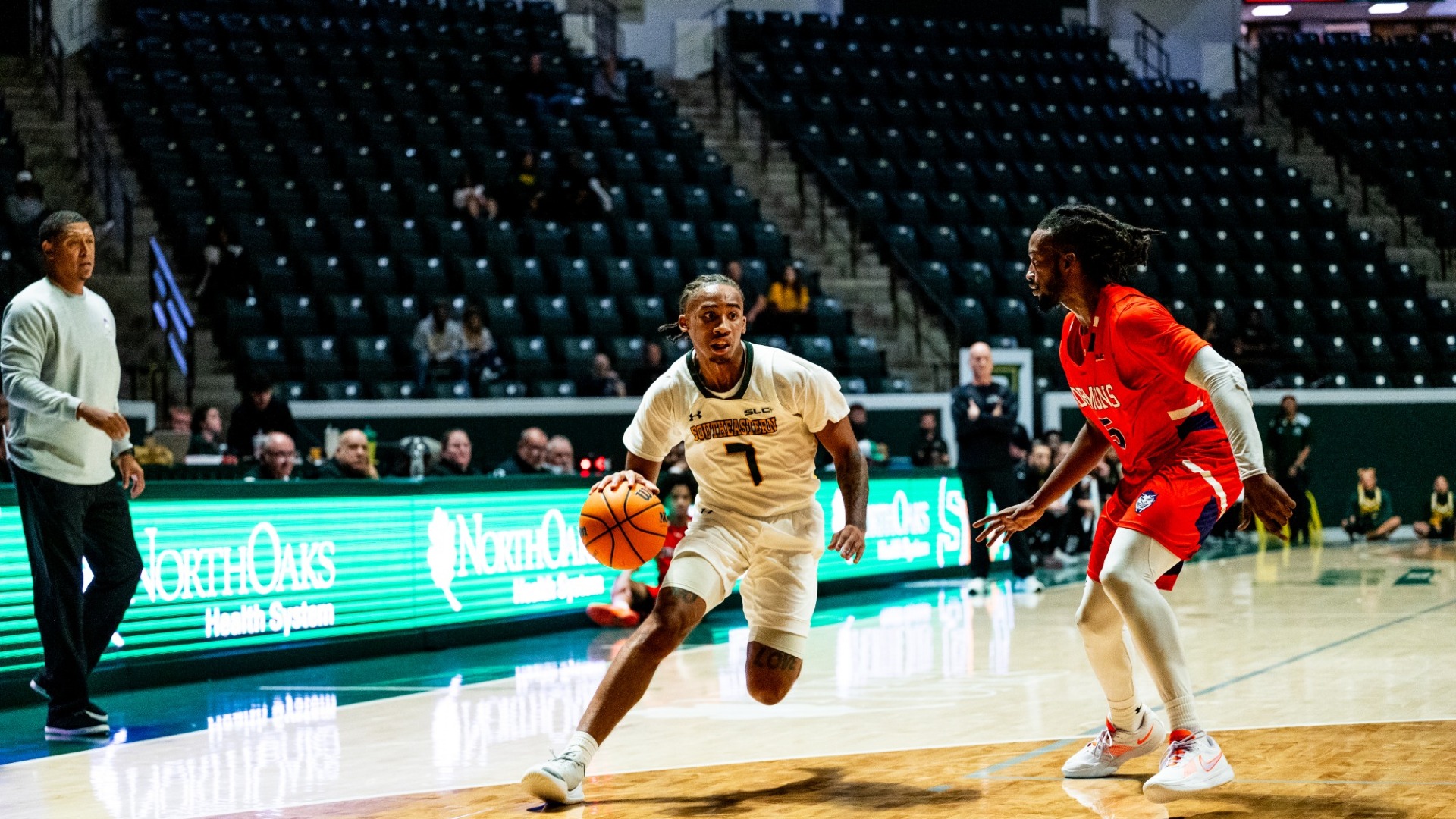 Seth Jones driving baseline against Northwestern State defender at home