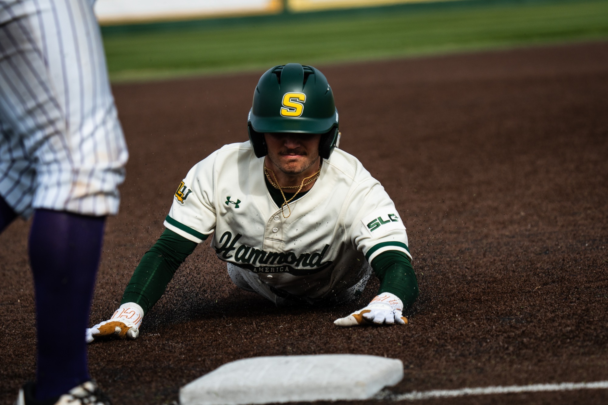 Dane Watts slides into third base on a triple against Alcorn State.