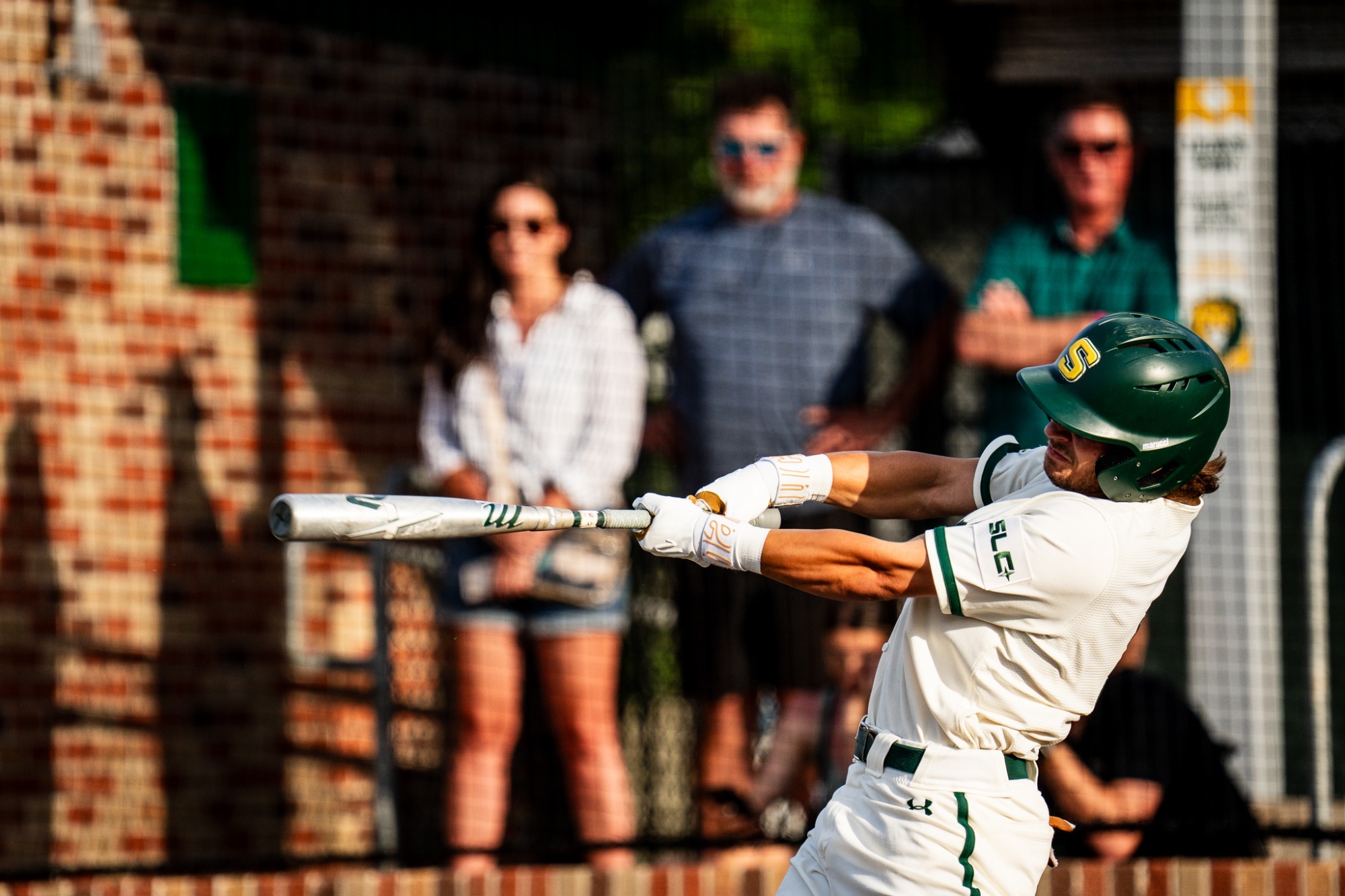 Ben Robichaux drives the ball out of the ballpark to left-center field.