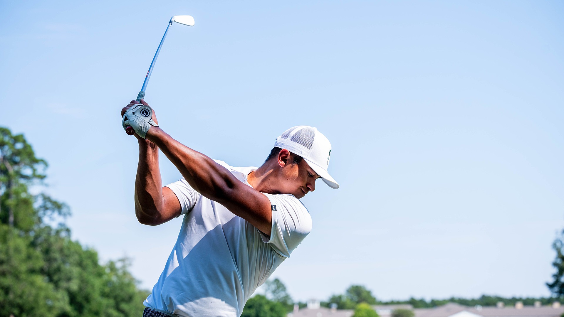 Gavin Ingram takes a swing for the Lion golf team