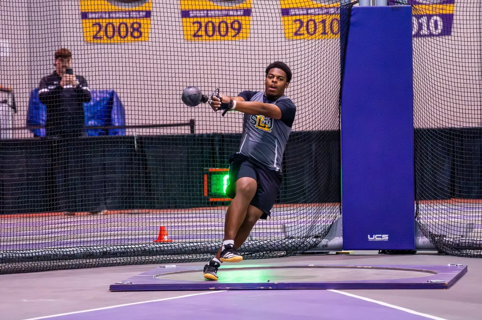 Bryson Thomas tossing in the weight throw