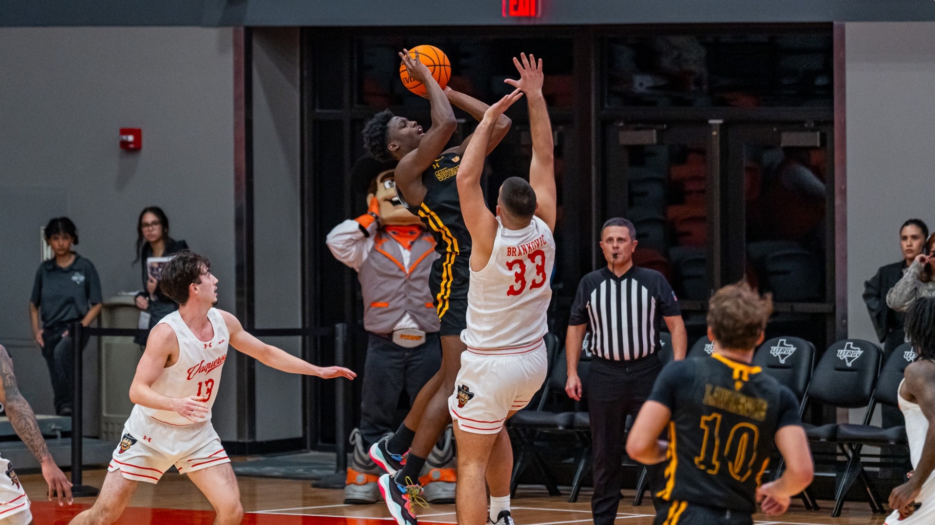 Jeremy Elyzee driving to the rim and working to score over UTRGV defender