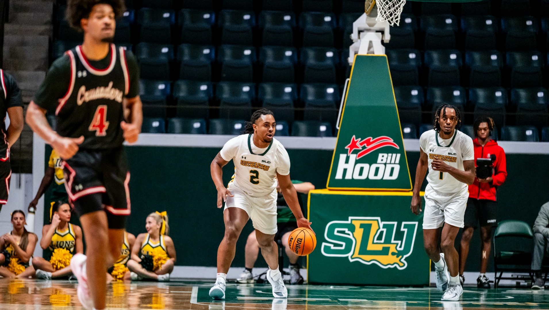Jalen Forrest dribbling up the court vs William Carey