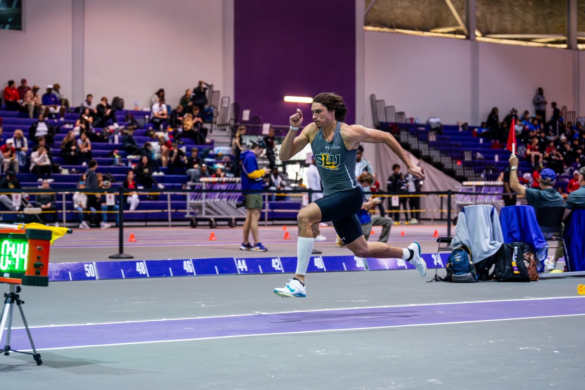 Ian McAlpine runs at Carl Maddox Fieldhouse