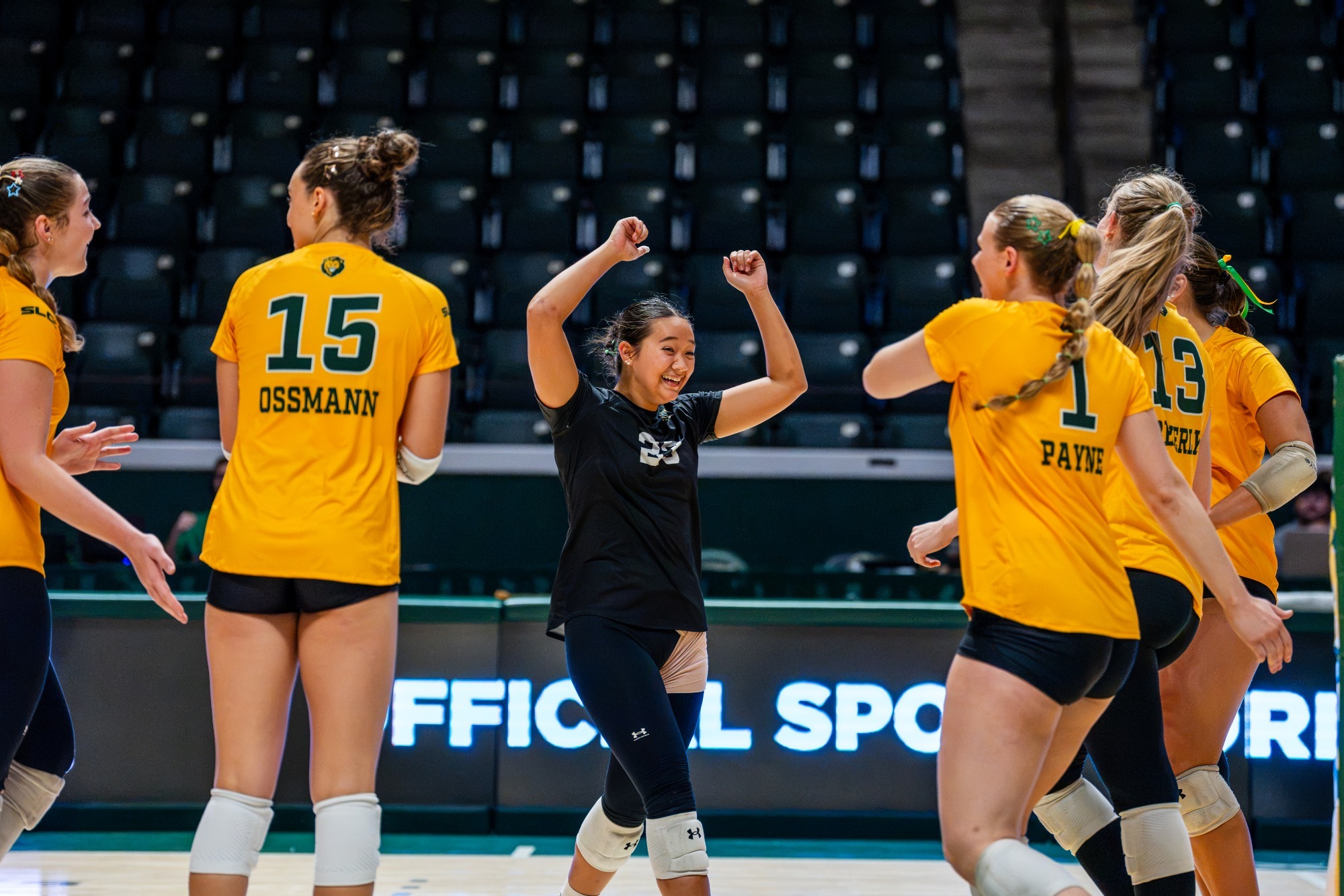 Audrey Vielguth and the Lions celebrate in the University Center