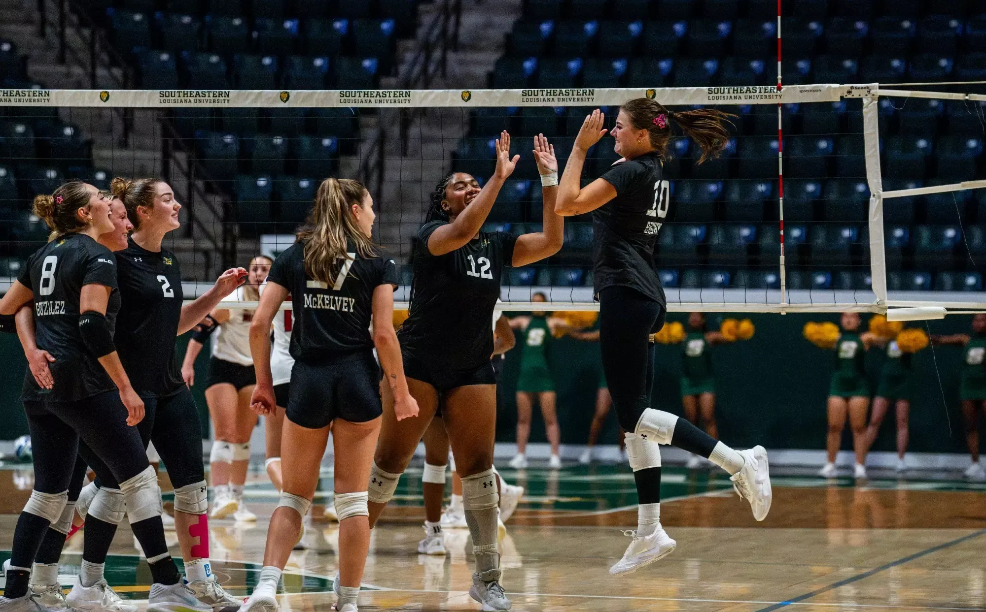 SLU celebrates after a point in the University Center