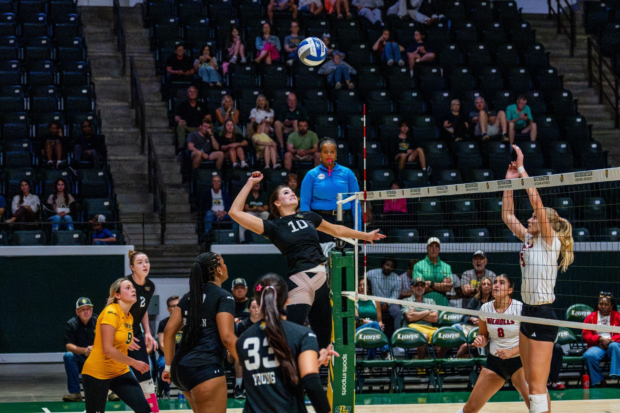 Gracie Brown swings for a kill in the University Center