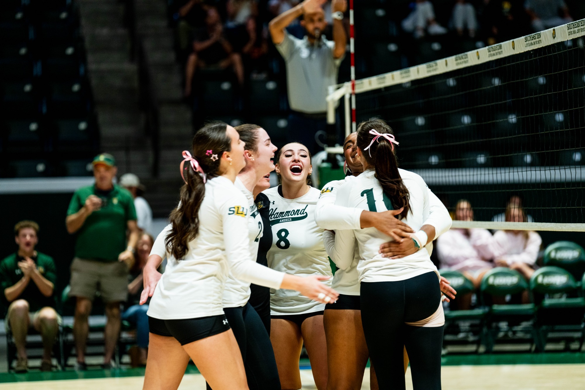 The Lions get hyped up after a point in the University Center
