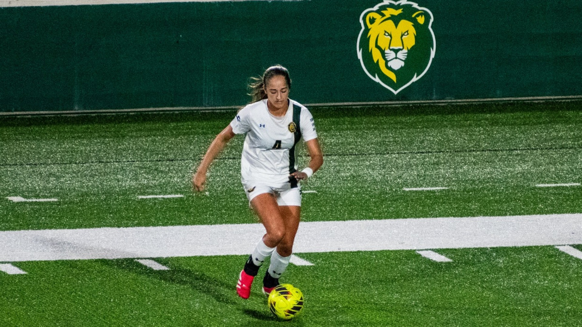 Alex Knight controlling the ball vs McNeese defender shown outside of the frame