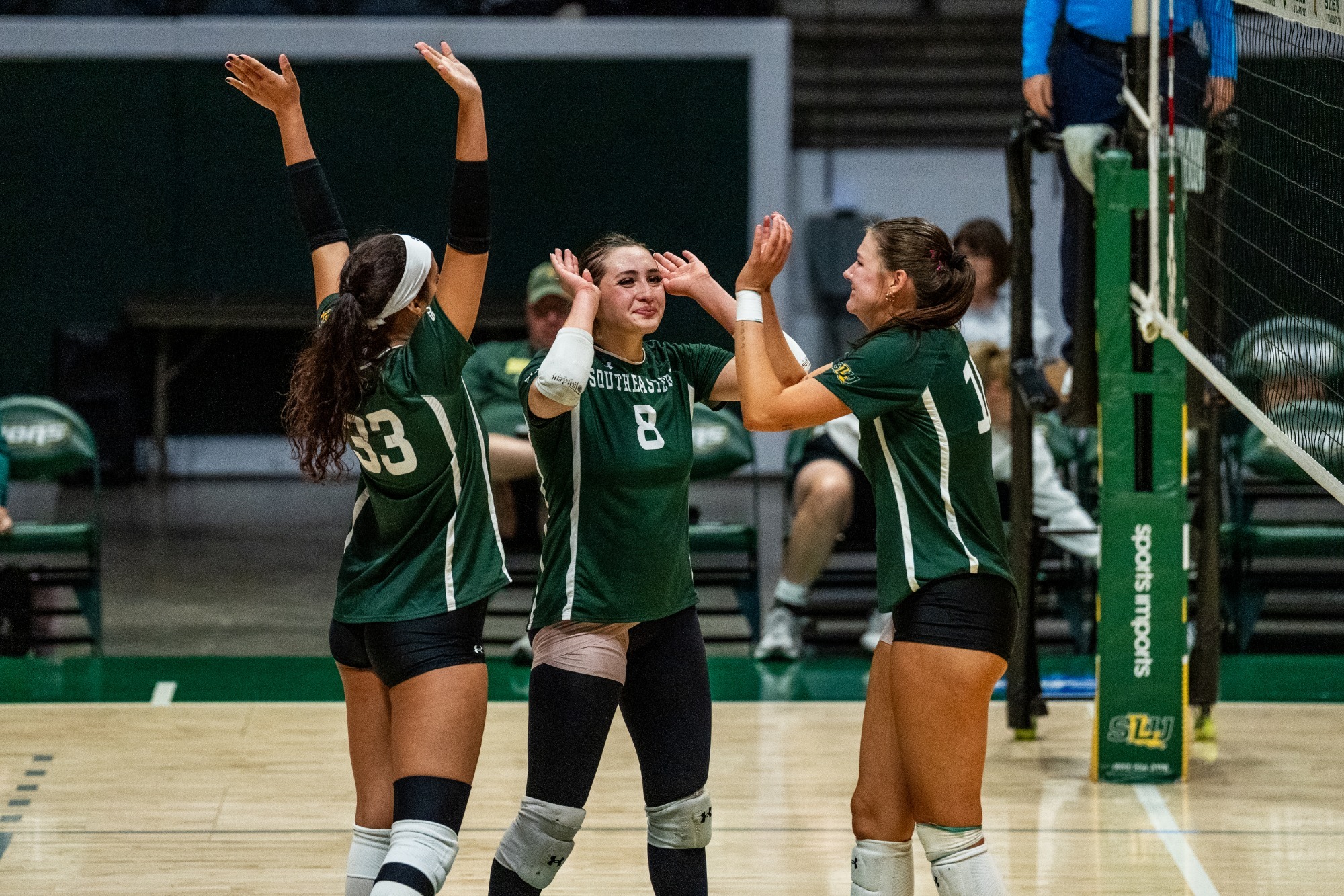 SLU celebrates after a point in the University Center