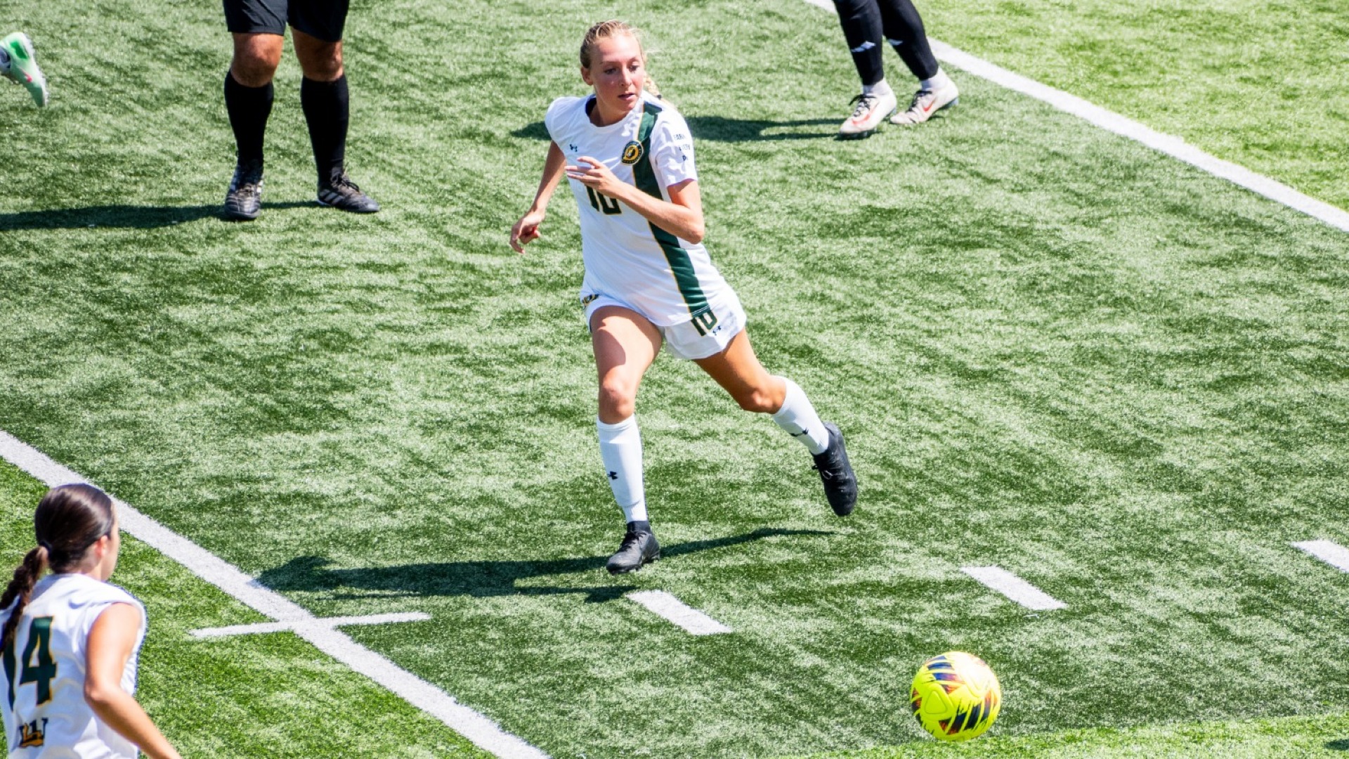 Kaitlyn Tung running ahead of UIW's offensive opponent in an effort to gain control of the ball