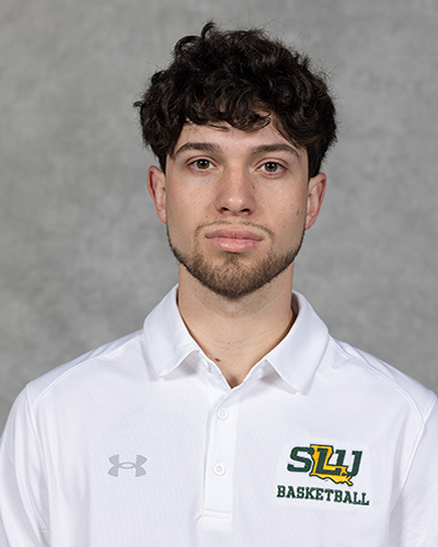 Southeastern men's basketball manager poses for a headshot wearing a white Southeastern basketball polo