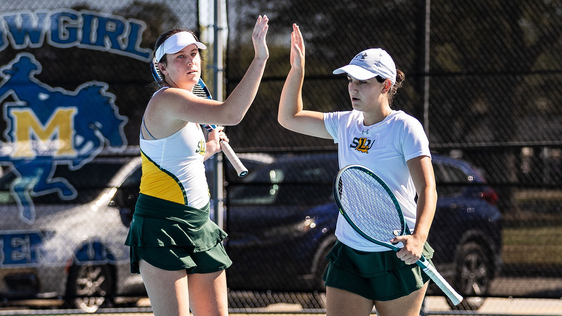Kennedy Hutto and Mariam Tetradze celebrate a point at the SLC Individual Championships Oct. 24, 2026