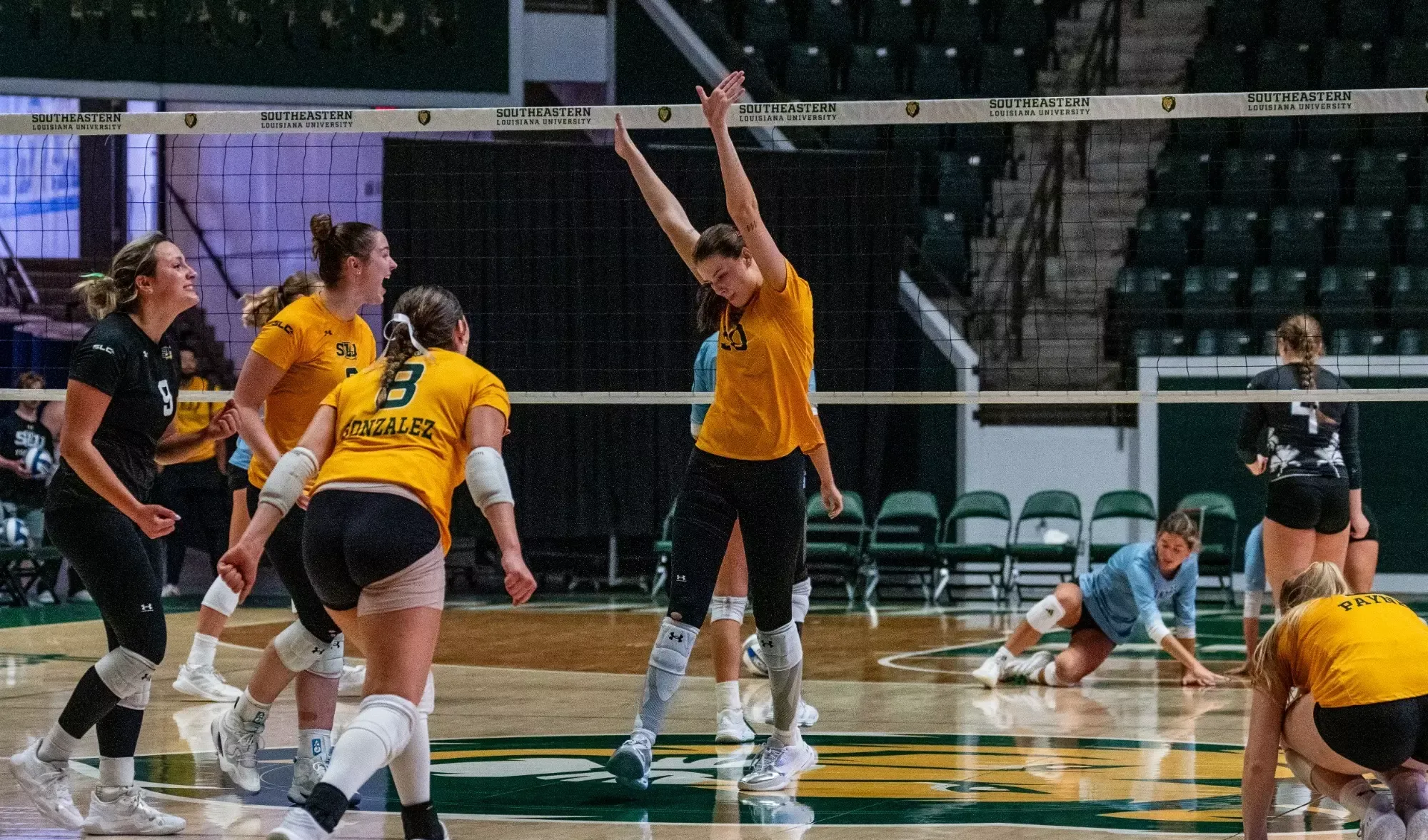 Gracie Brown celebrates after a block in the University Center