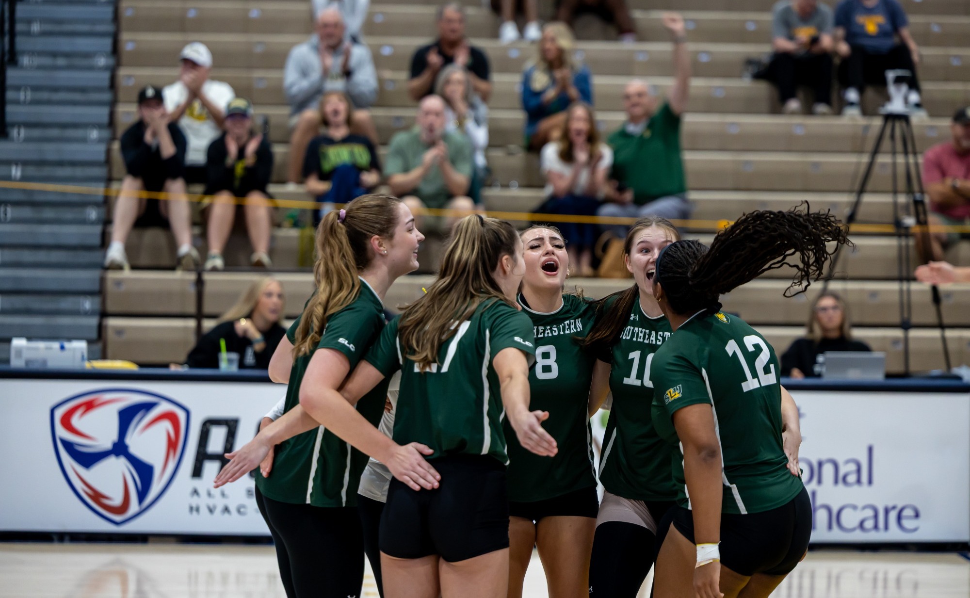 SLU celebrates after a point at The Field House