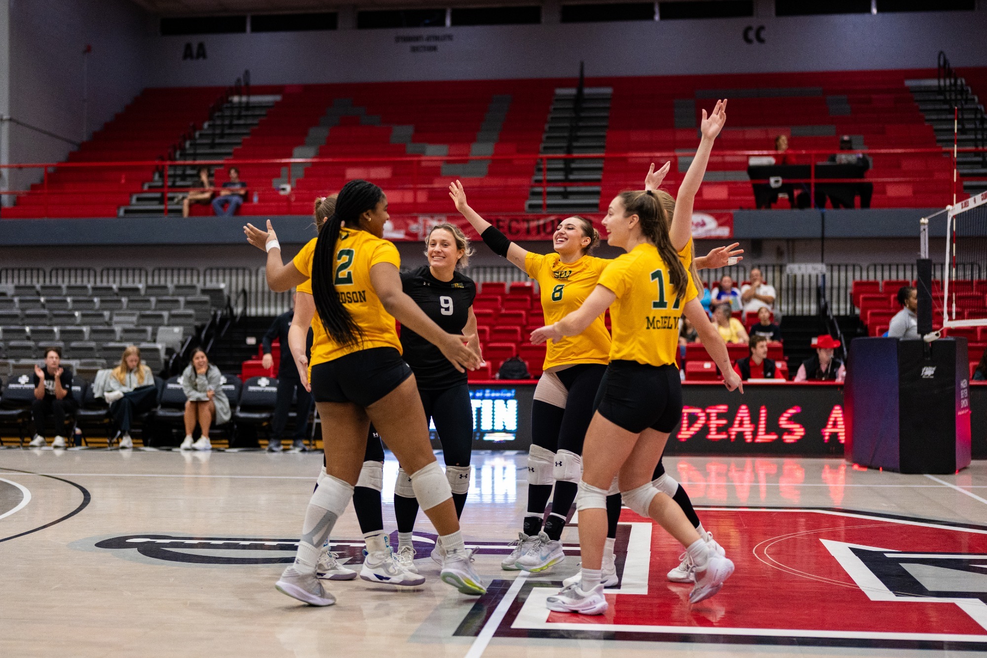 SLU celebrates in a match at Stopher Gymnasium