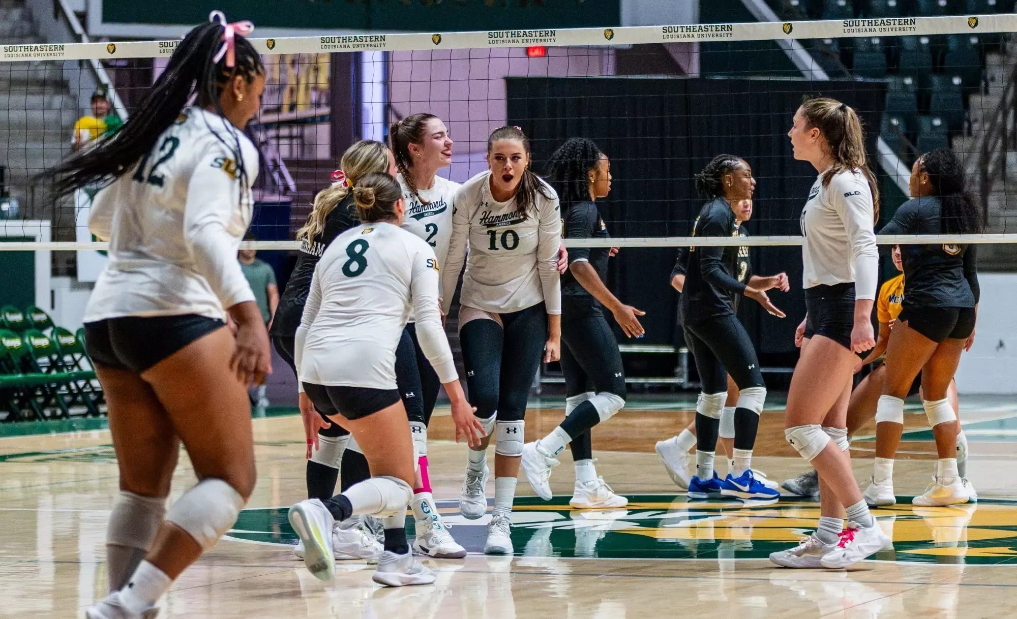 Gracie Brown and the Lions celebrate after a block in the University Center