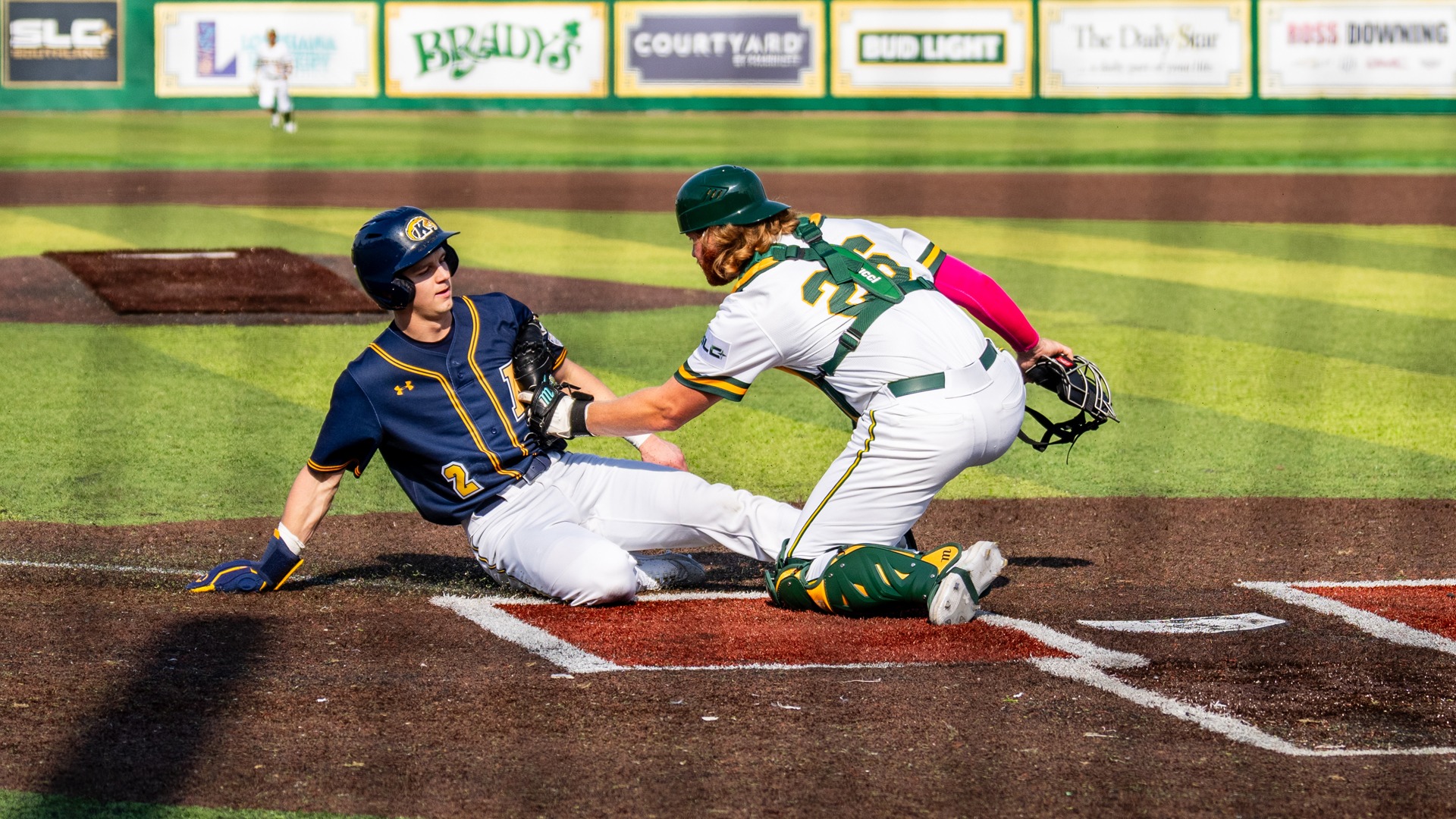 Blaise Priester tags out a Kent State runner at home plate.