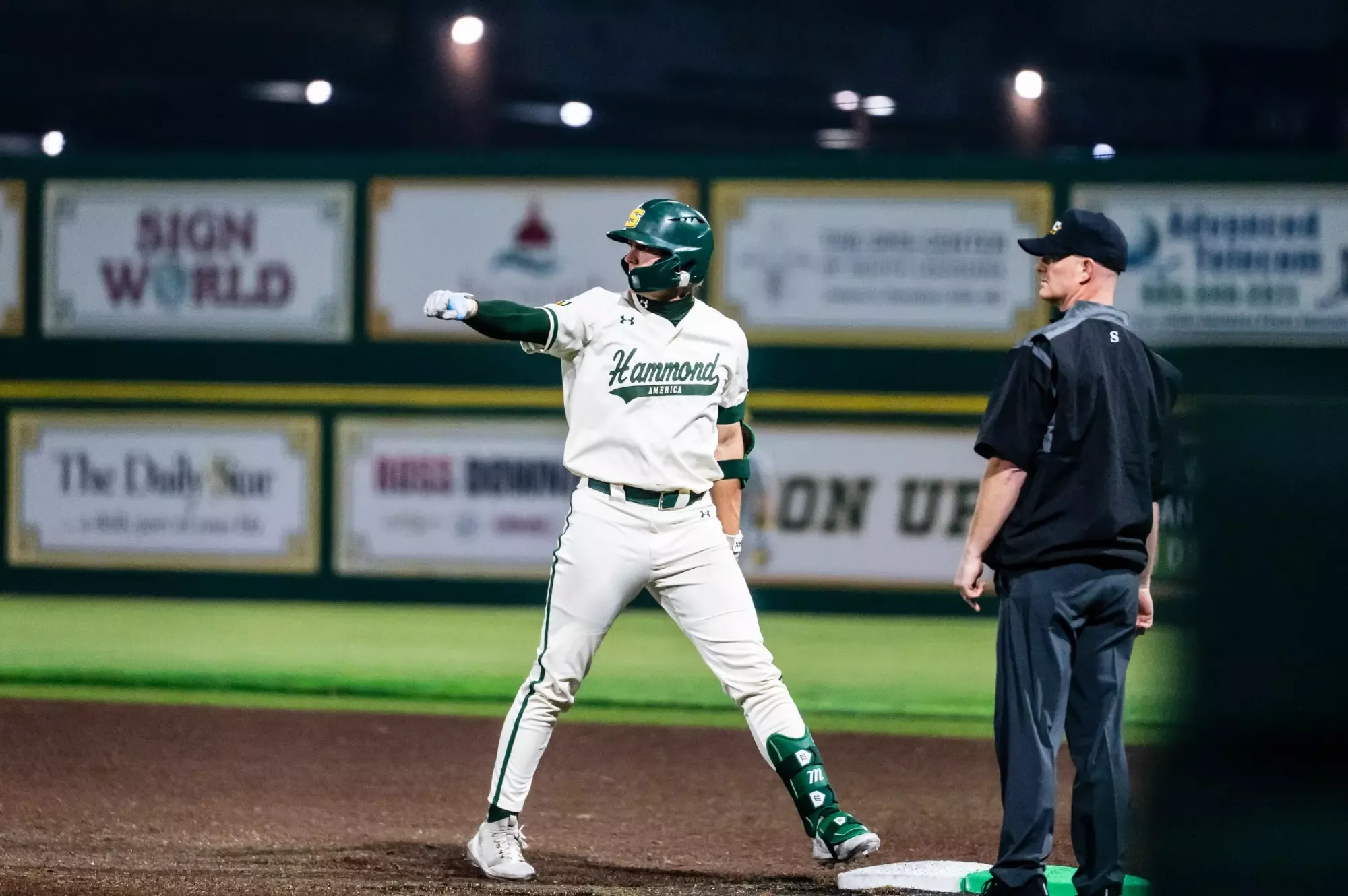 Justin Williams holds out his fist toward the Lion dugout following a single.