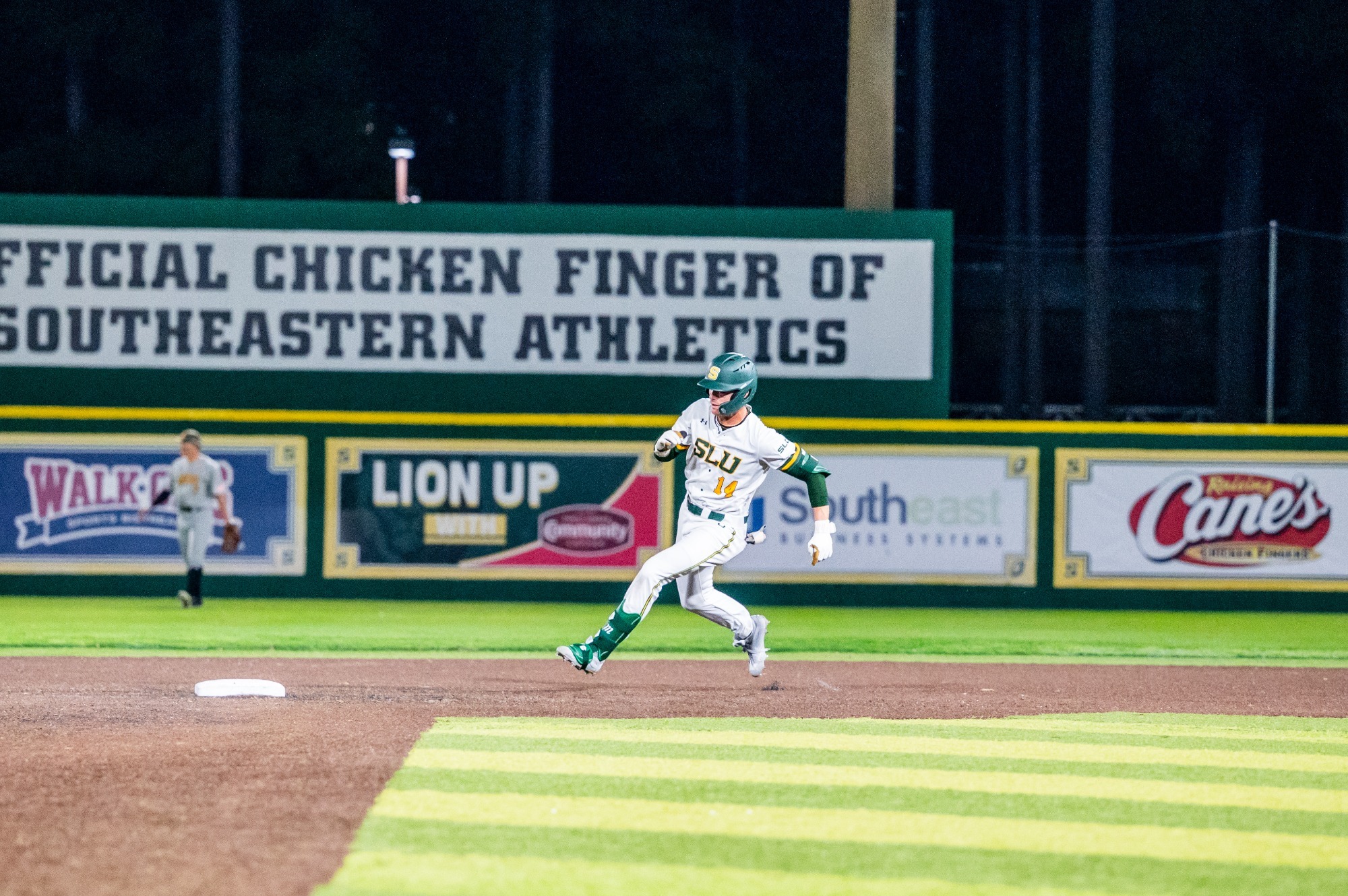 Justin Williams rounds second and heads for third with his leadoff triple in the eighth inning against No. 20-ranked Southern Miss.