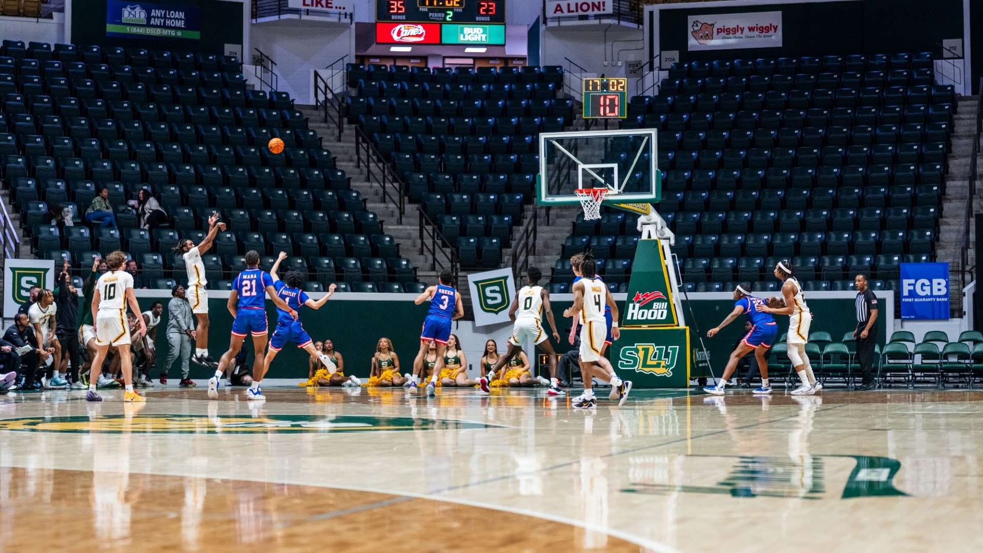 Makhi Myles shooting a corner three-pointer vs HCU defender