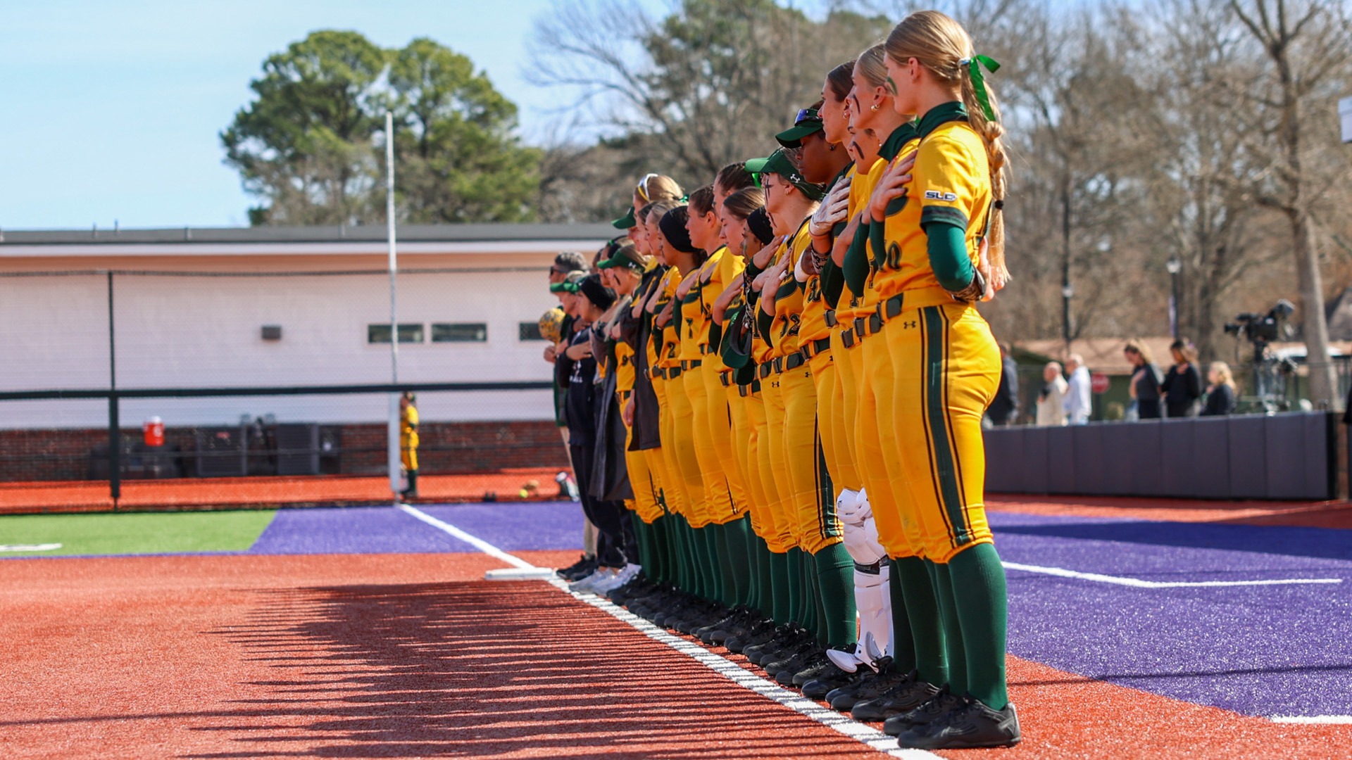 SLU Softball Team stands for the national anthem before its game versus St. Louis Feb. 20, 2026