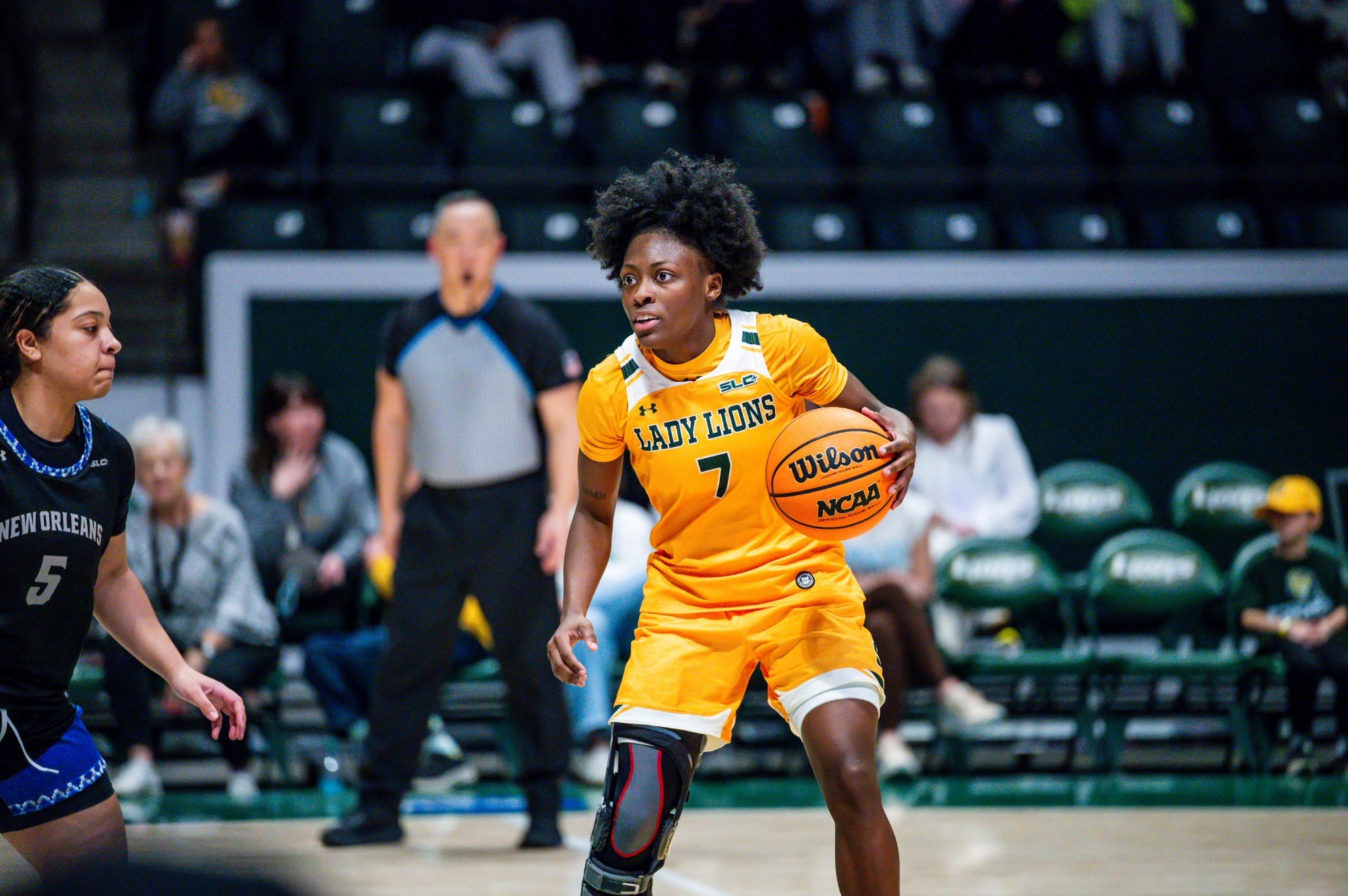 Aliyah Collins looks to pass in the University Center