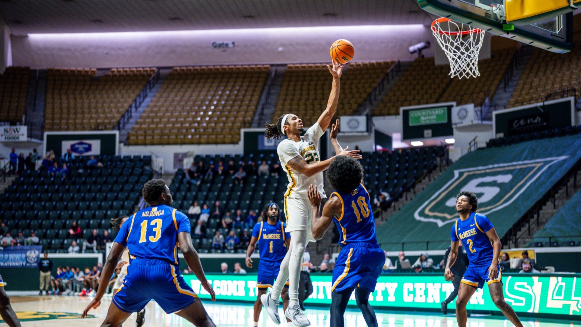 Isaiah Gaines with a hook shot vs McNeese defender