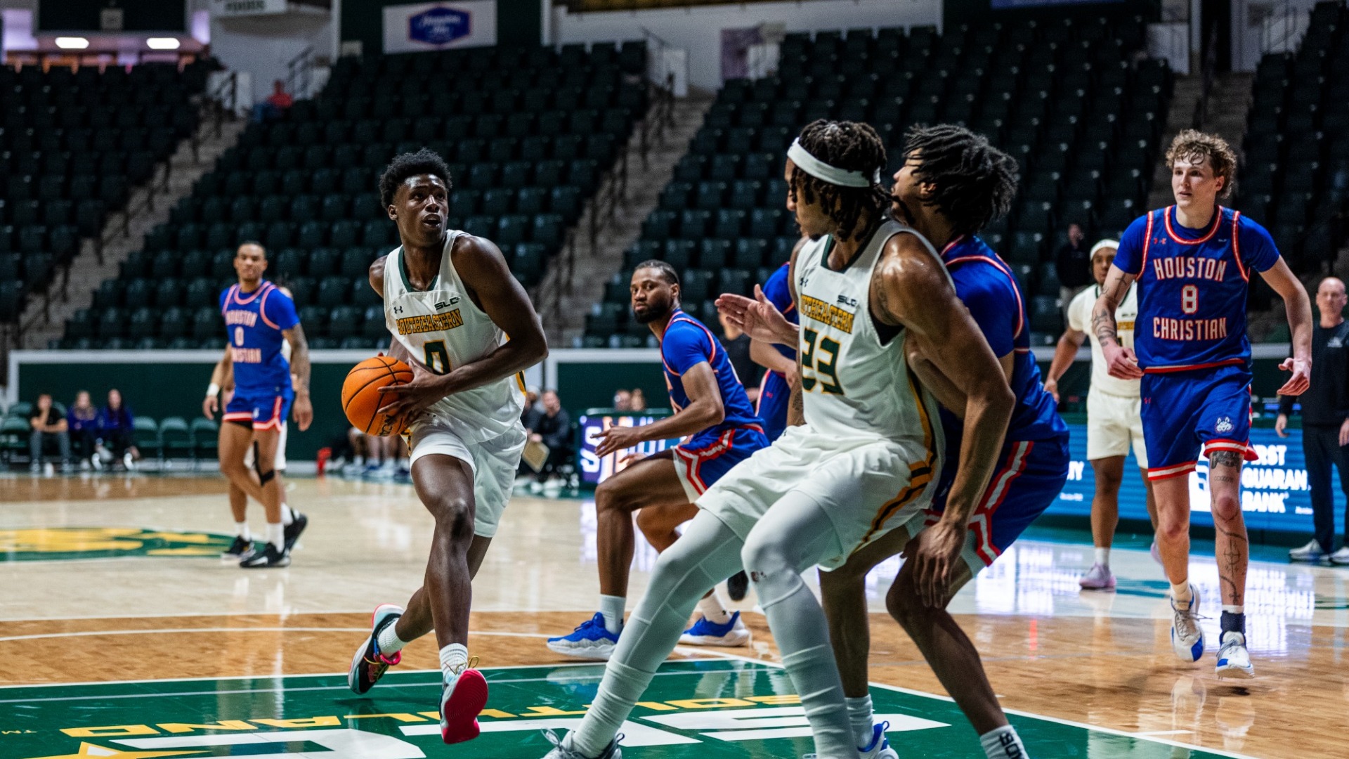Jeremy Elyzee driving to the rim vs HCU defender