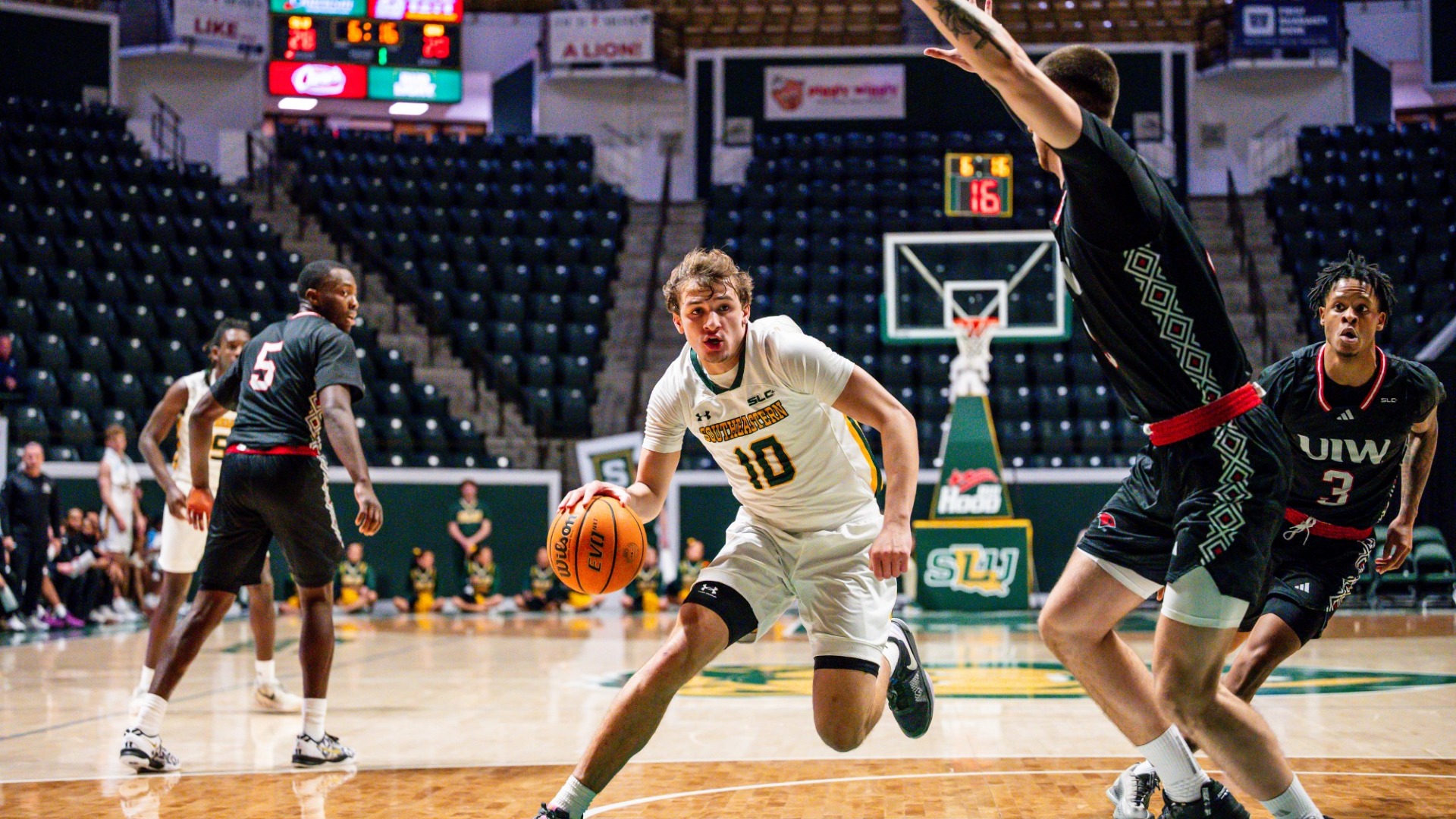 Jaiden Lawrence driving to the rim vs UIW defender in the University Center