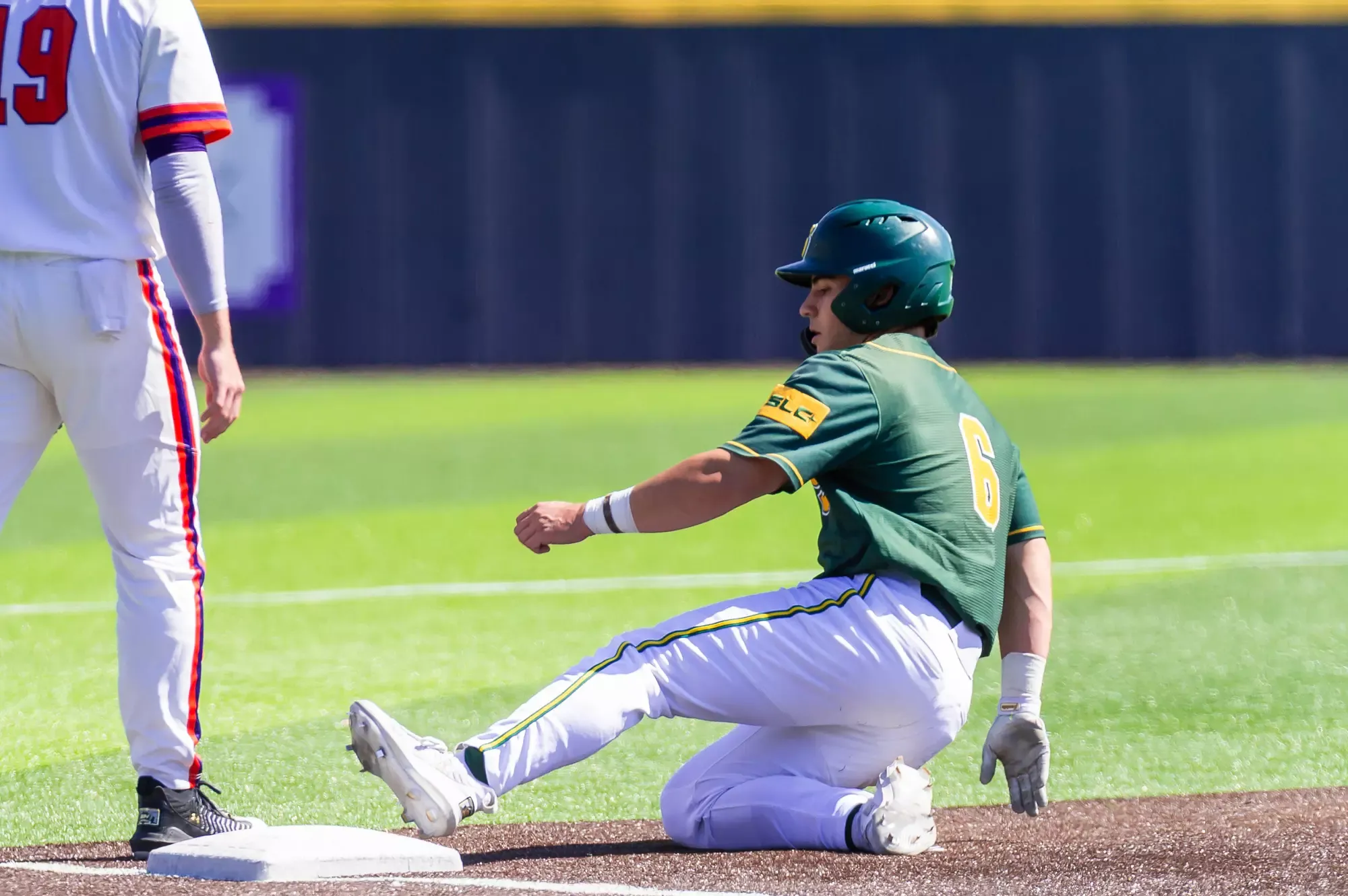 Ben Robichaux slides safely into third base.