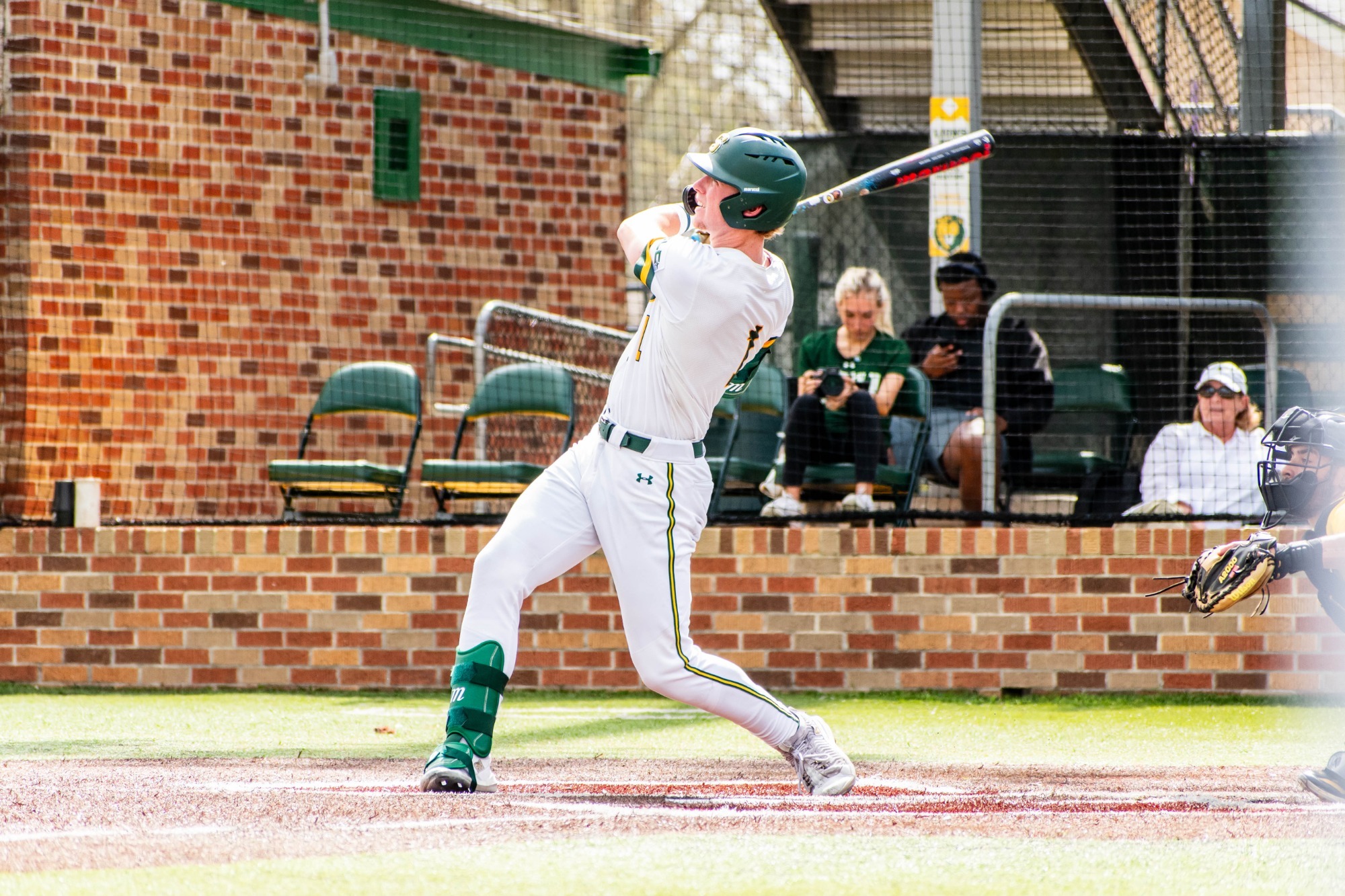 Connor Cuff drives a pitch deep.