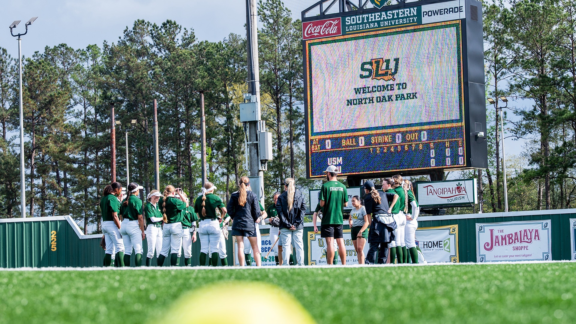 2026 Softball Team huddles before 11-3 win over Southern Miss March 12, 2026