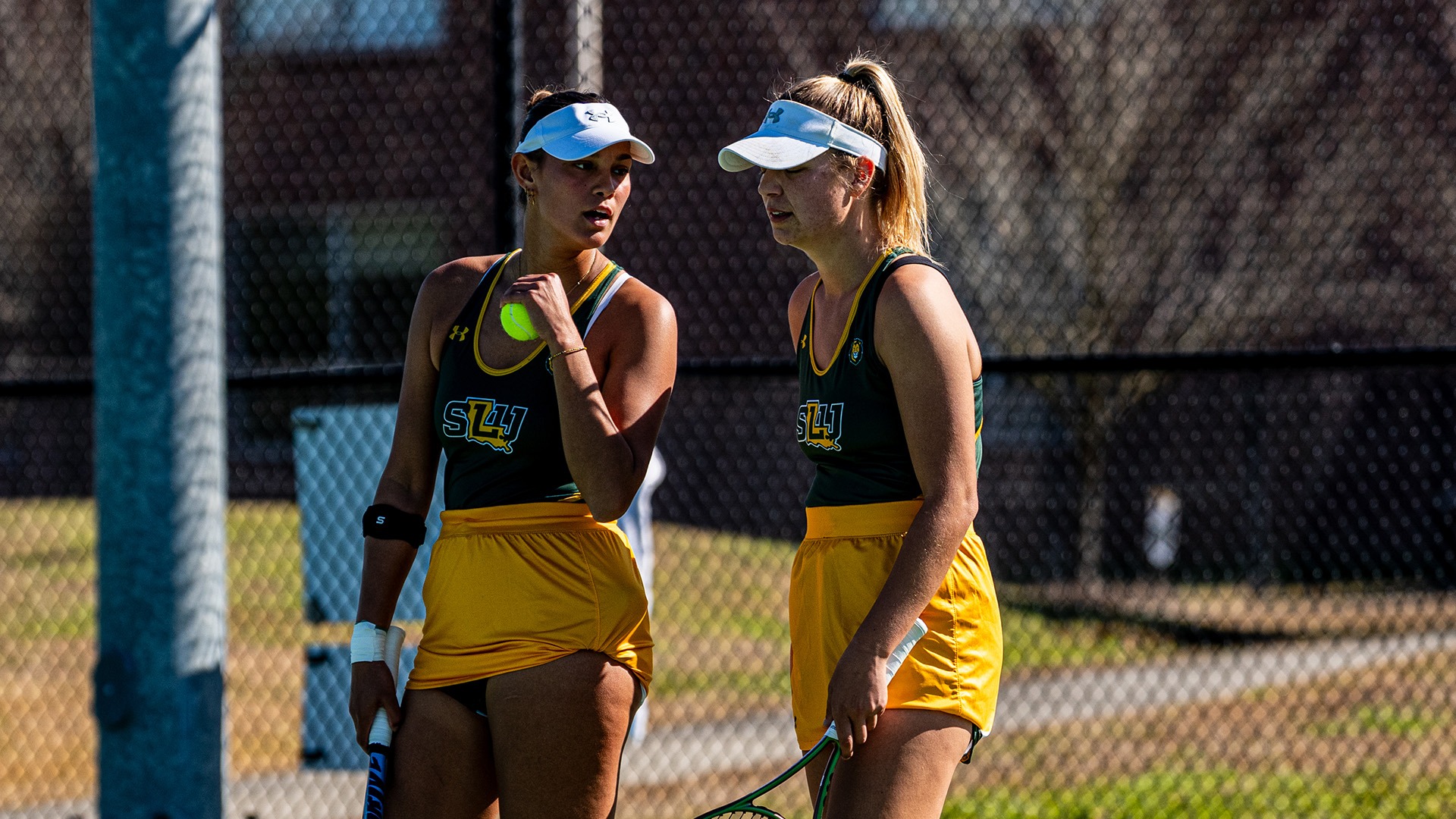 Bente Bierma (left) and Paige Duncan (right) discuss strategy