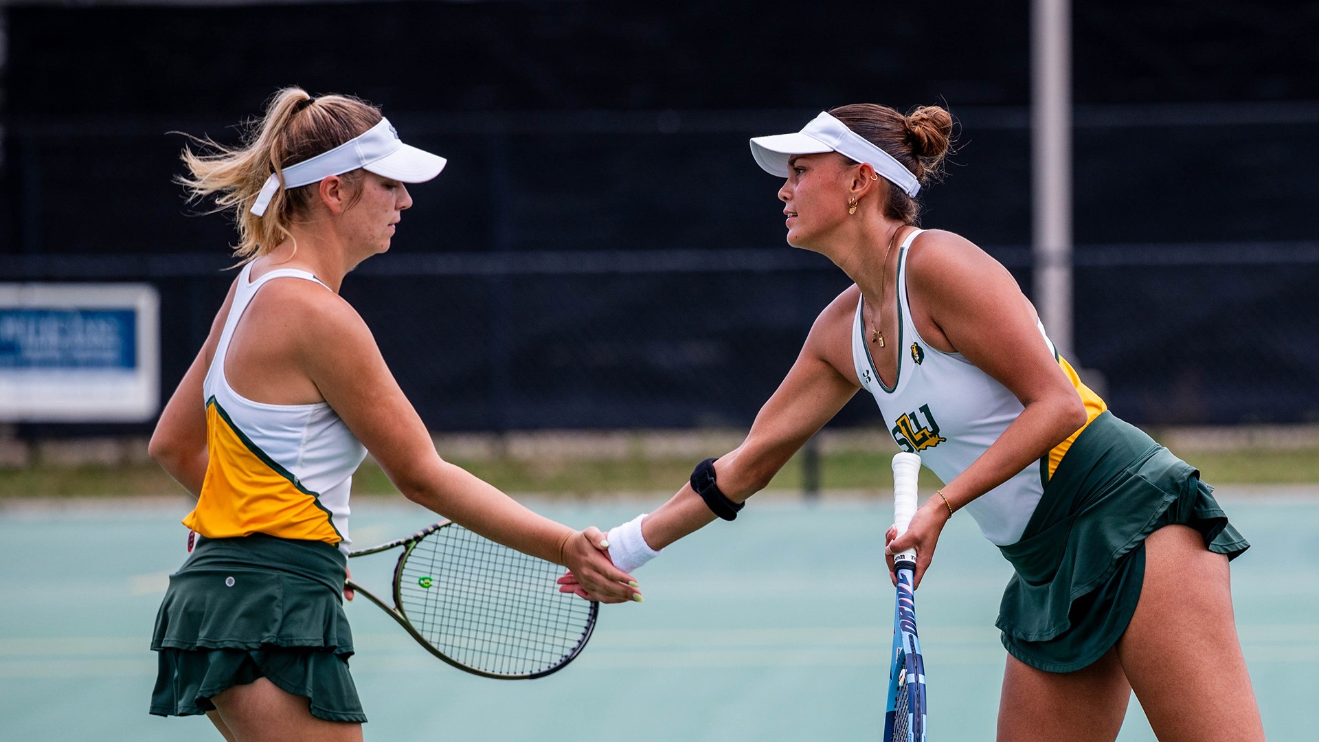 Bente Bierma and Paige Duncan celebrate a point