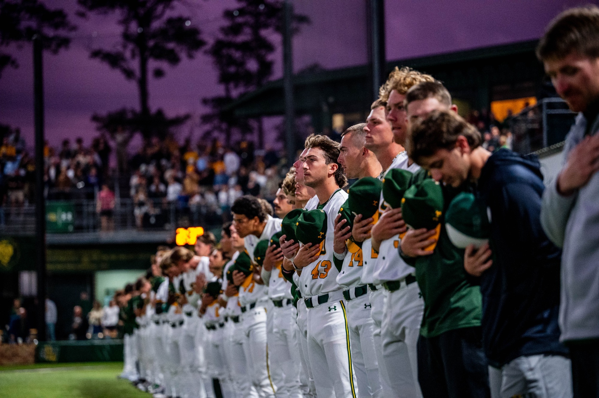 The Southeastern baseball squad lines up for the national anthem.