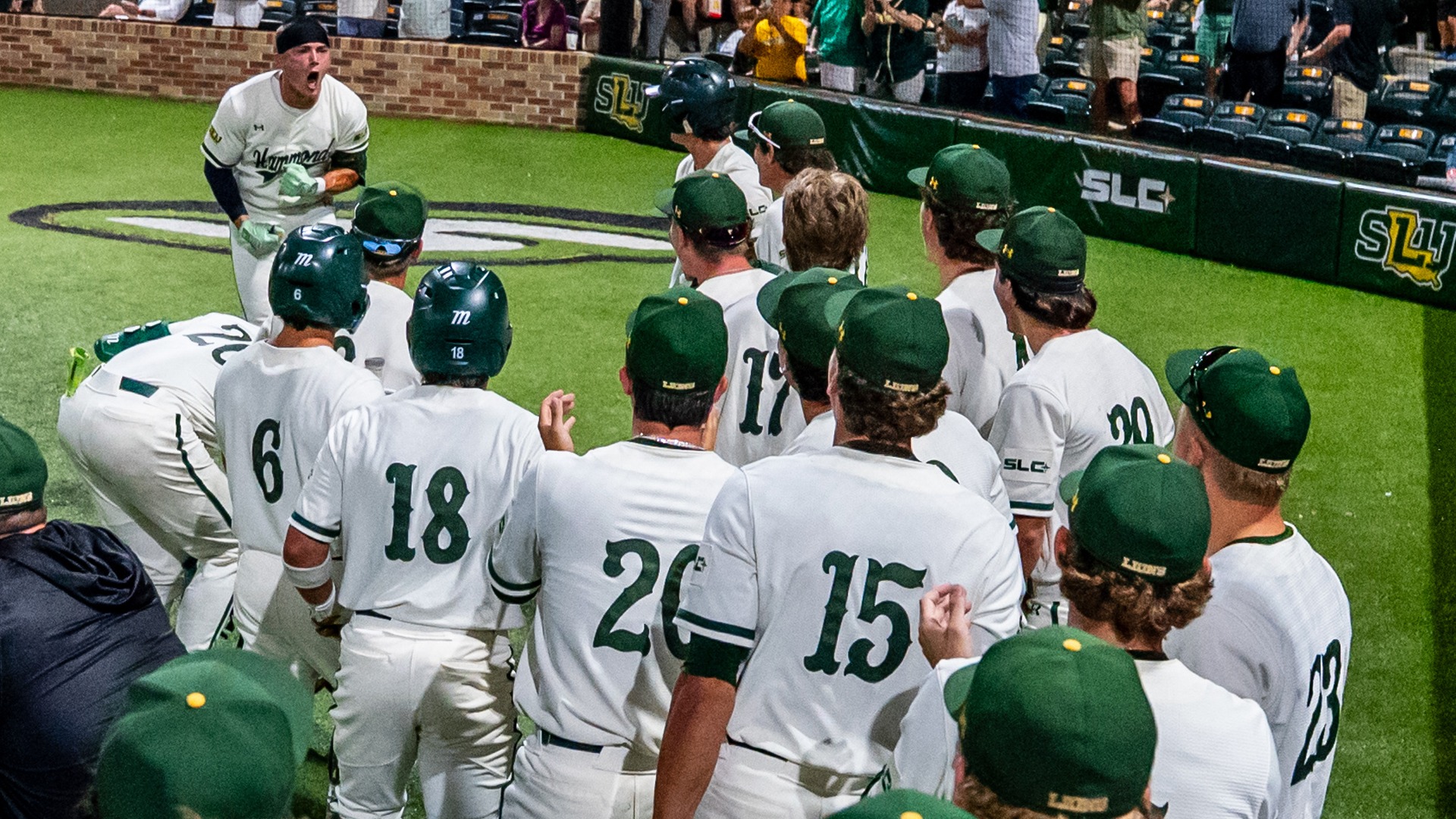 Justin Williams celebrates on his way back to the dugout following his third home run of the game.