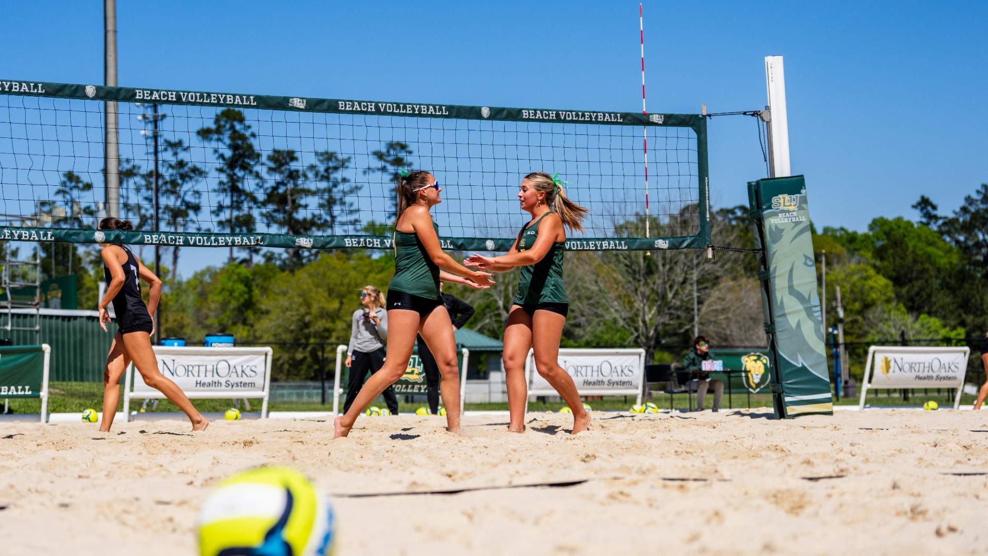 Mia Sauers - Gabby Hrubanova joining for a handshake after a set win vs Spring Hill