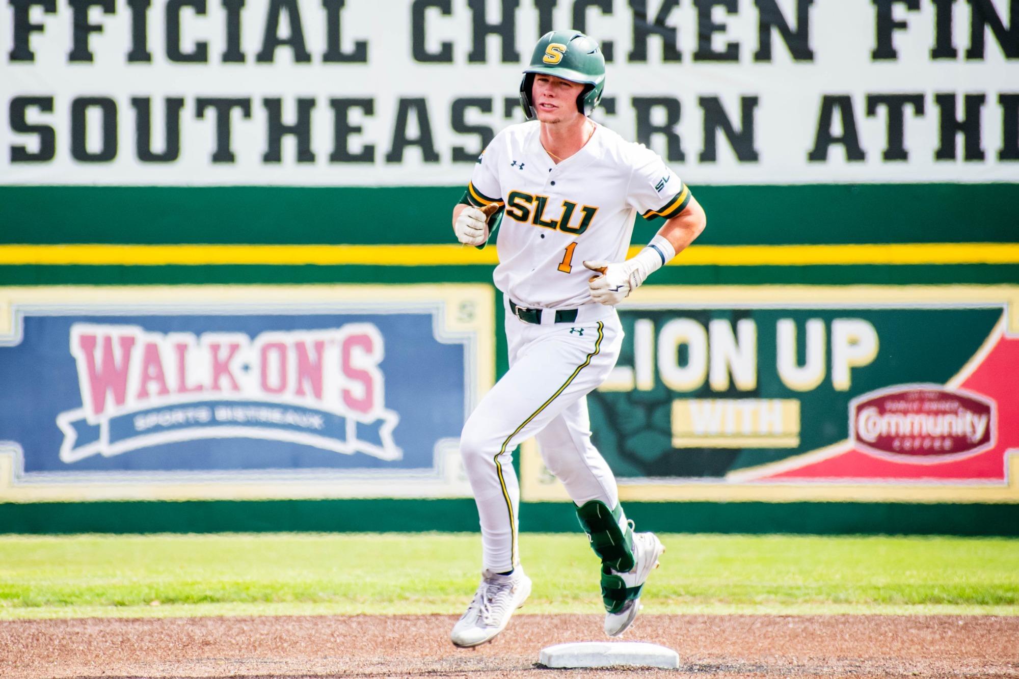 Connor Cuff rounds second base after hitting a grand slam.