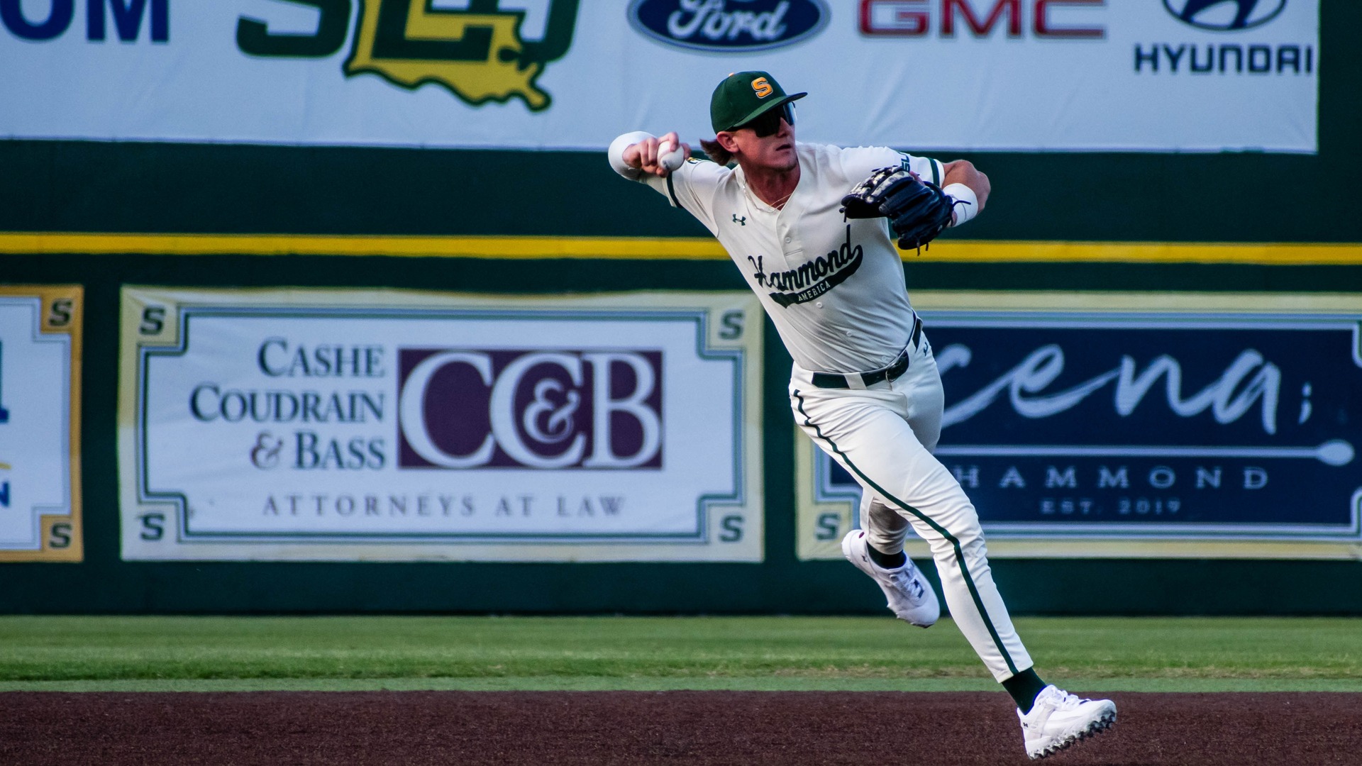 Alex Perry fires the ball across the diamond.